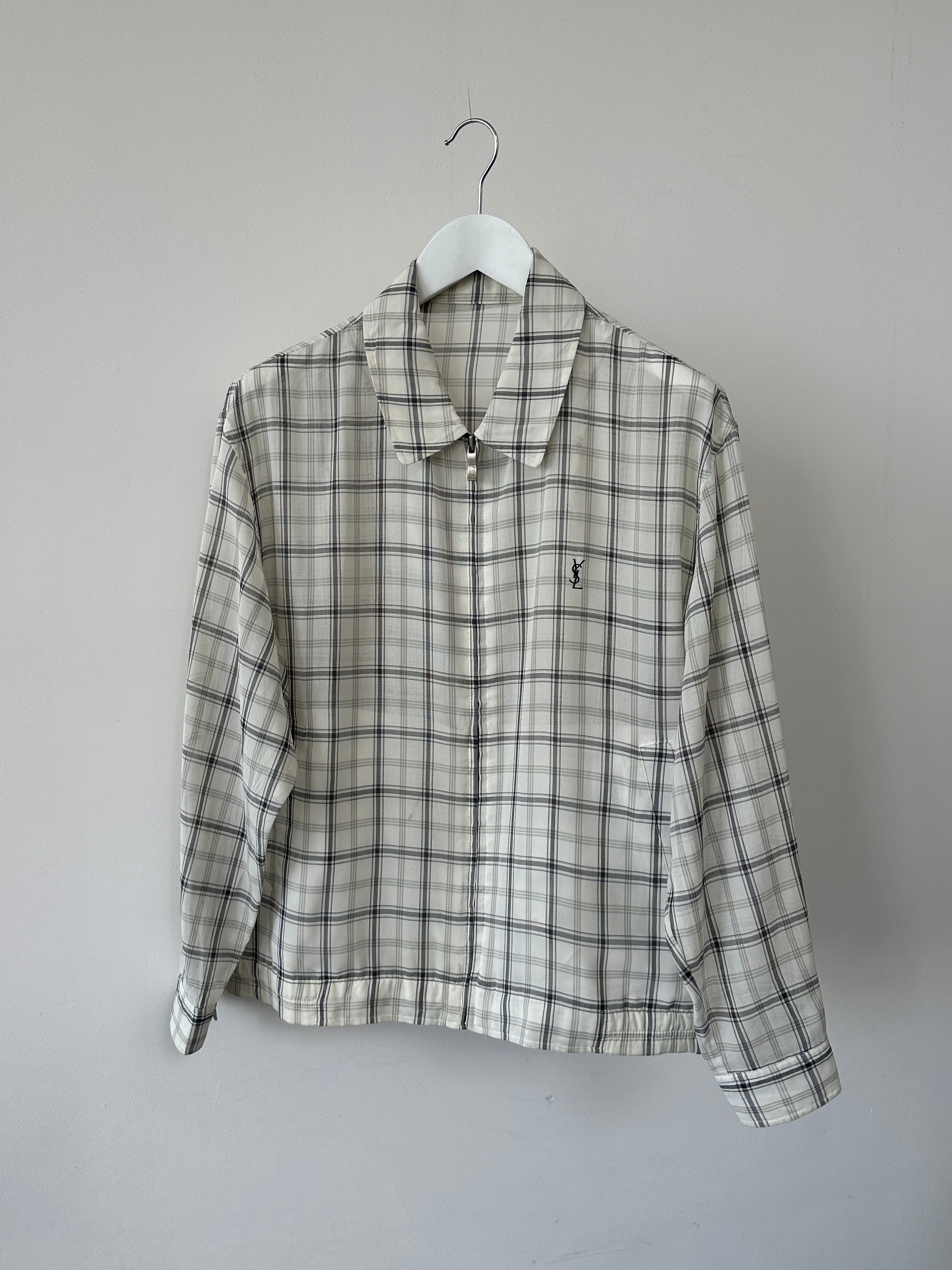 Yves Saint Laurent Pour Homme check logo bomber jacket in black with white logo pattern, front view, size M/L.