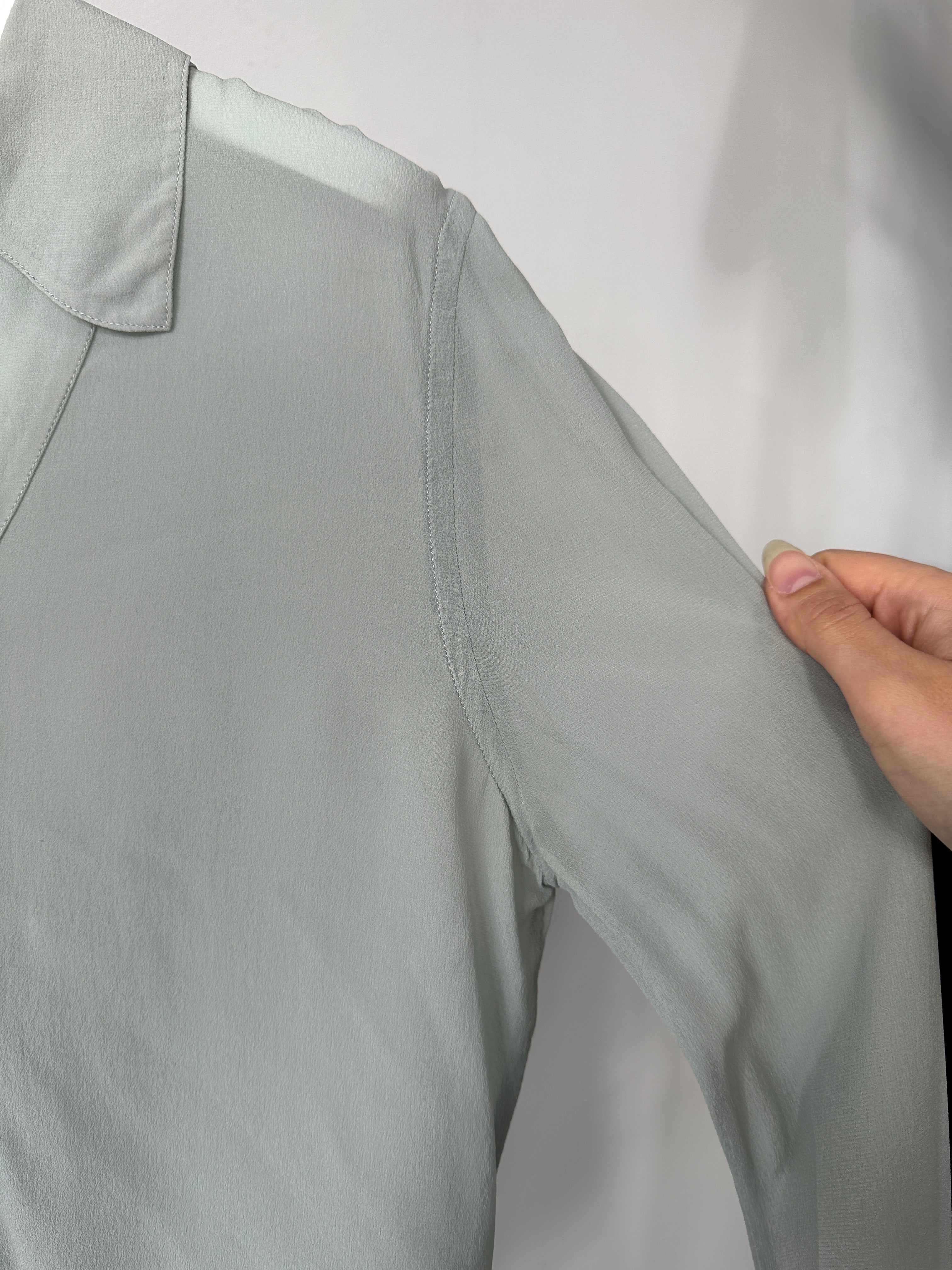Giorgio Armani Black Label pure silk sheer blouse in black, lightweight shirt with a relaxed fit, displayed flat on a white background.