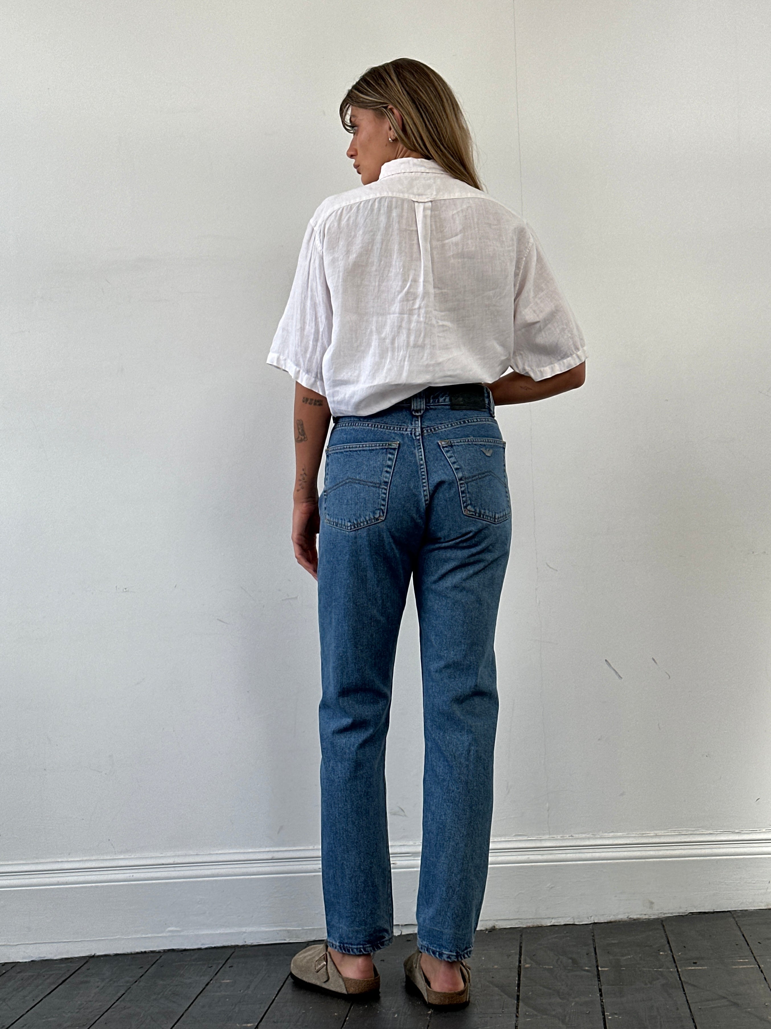 Armani Jeans mid wash tapered leg high-waisted denim jeans with belt loops and front pockets, size W28.