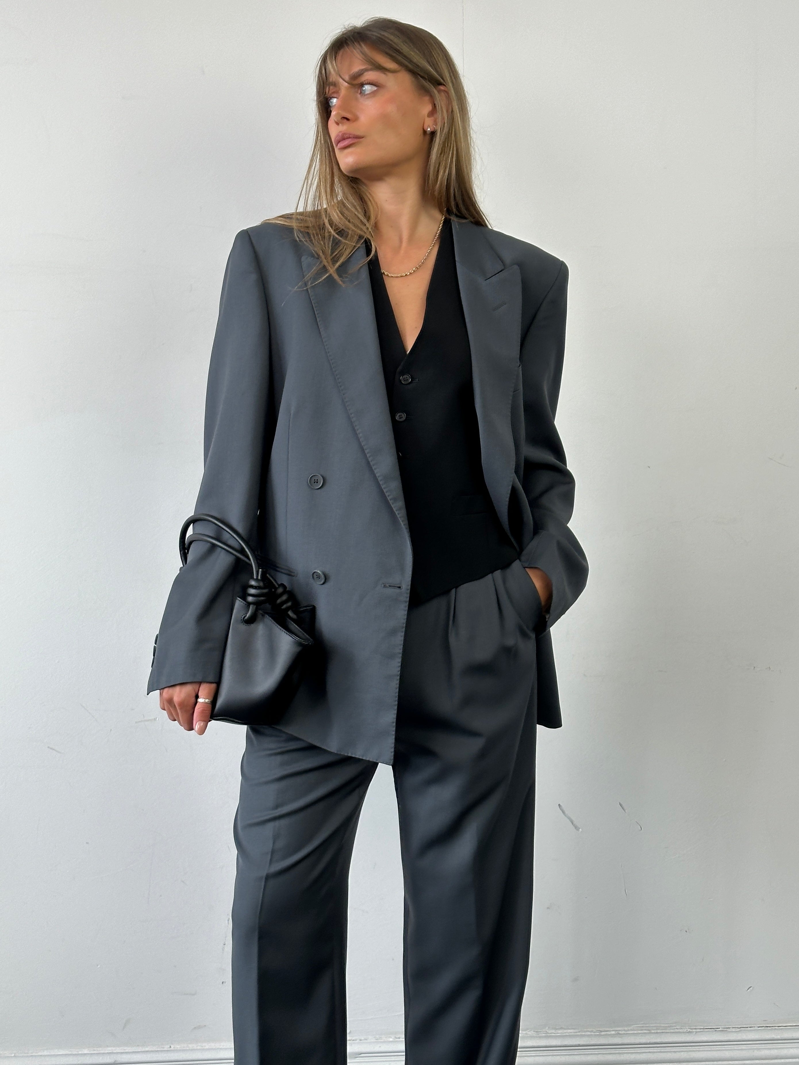 Vintage Italian double-breasted wool blazer, size 40R/W28, featuring classic tailored design and timeless style.
