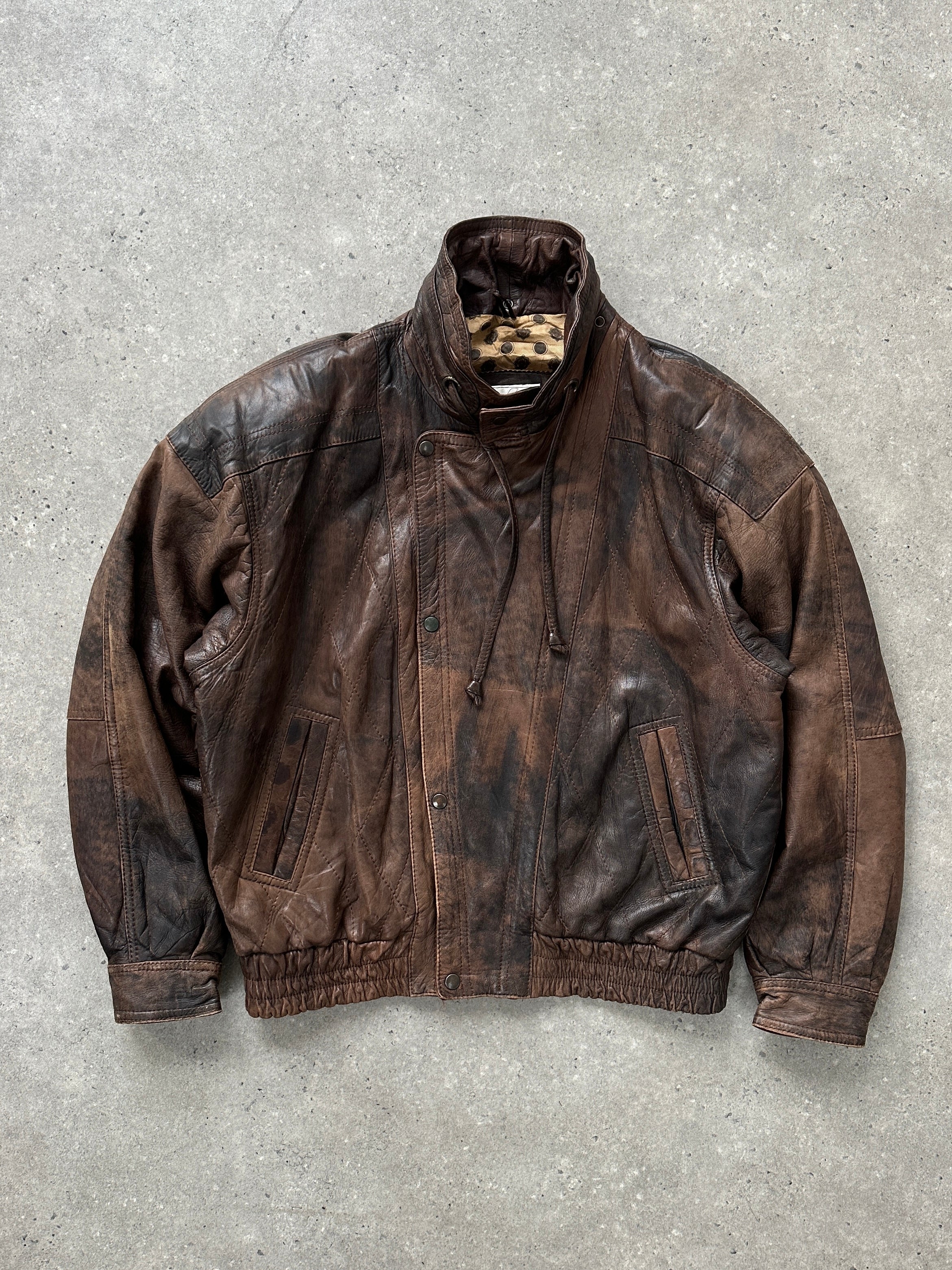 Vintage 1990s high neck aged leather bomber jacket in XL with a rugged, worn-in look and classic design.