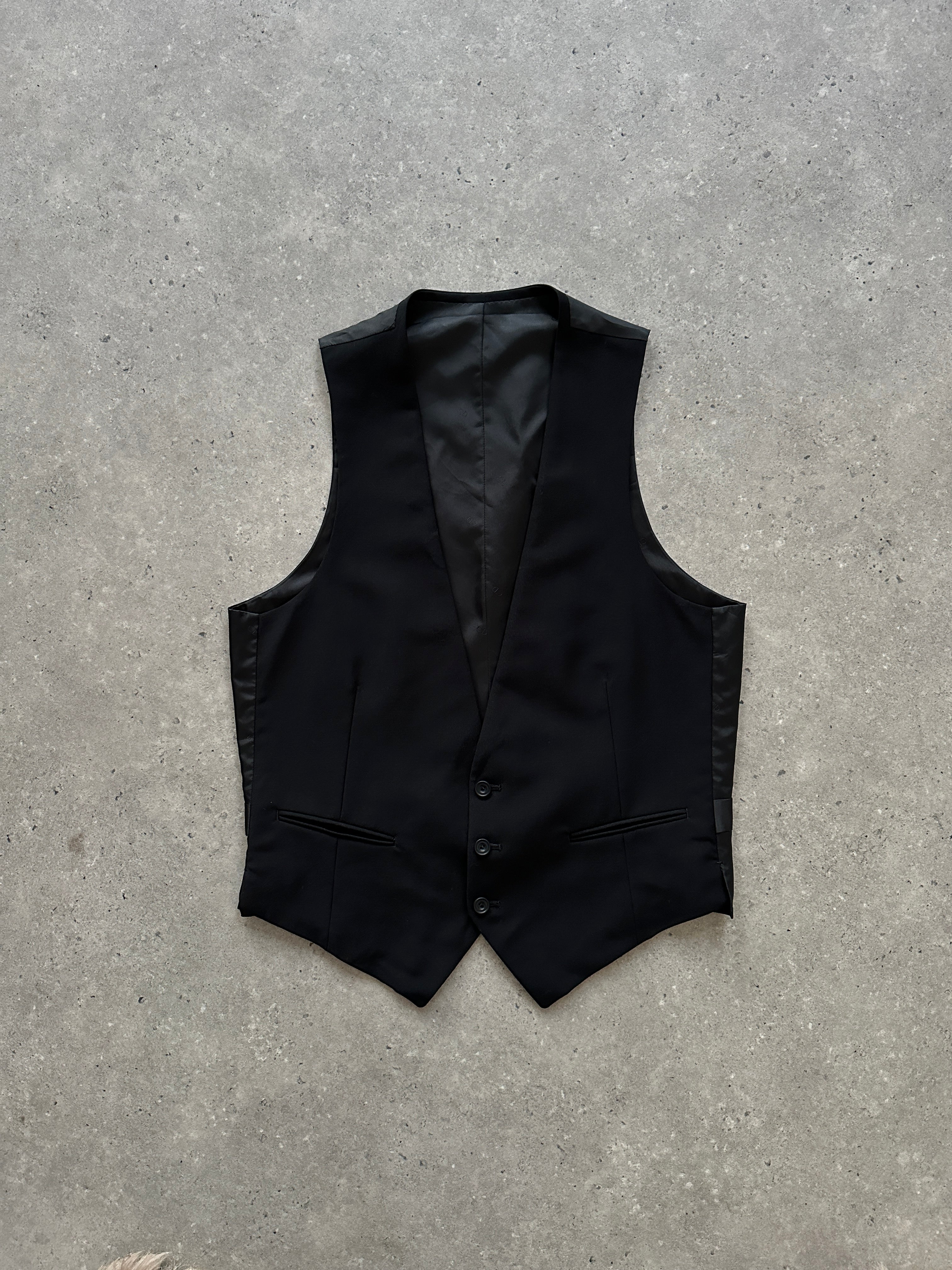 Christian Dior wool tailored waistcoat in size M, featuring classic design and structured fit, shown on a neutral background.