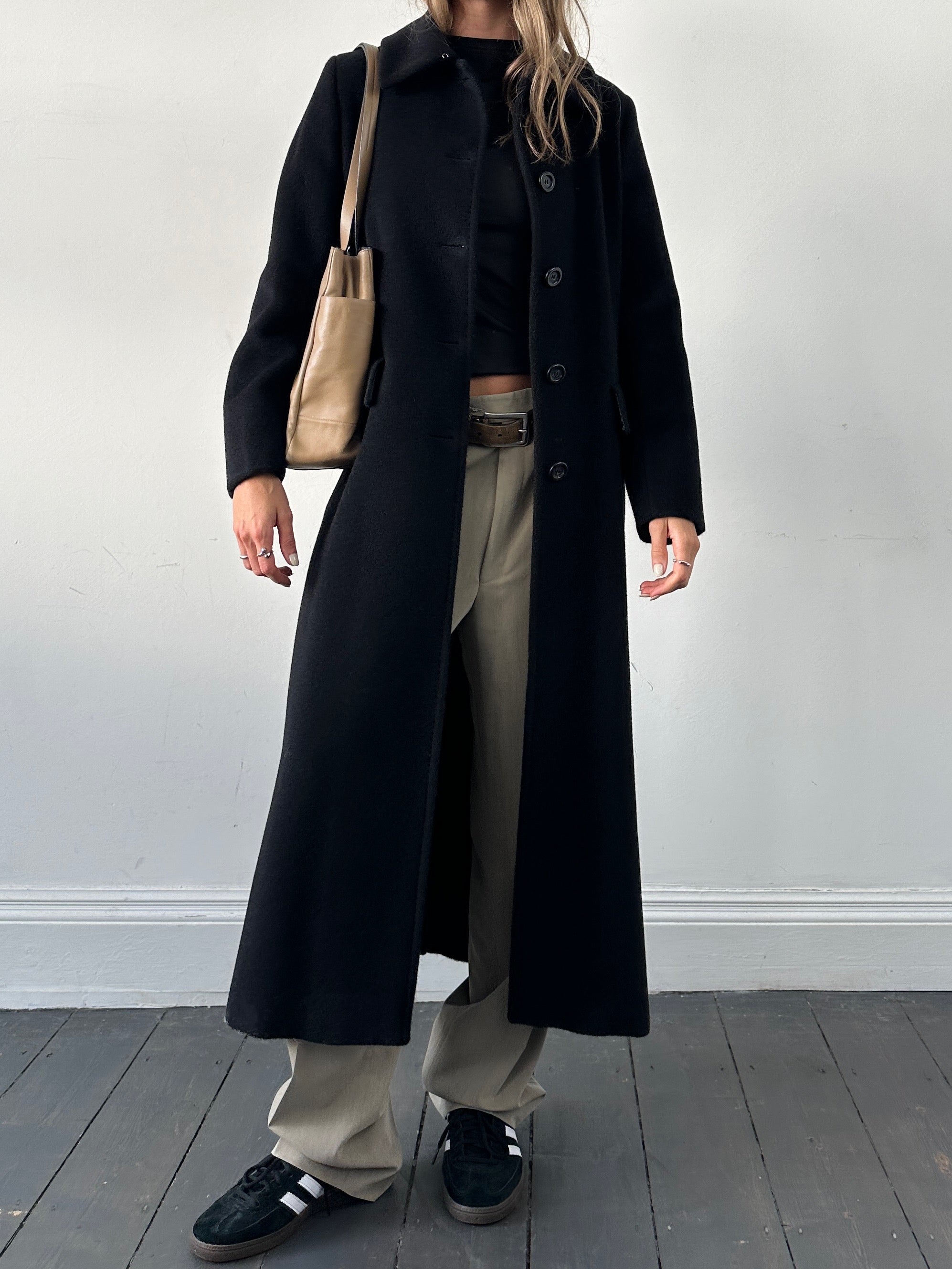 Prada contrast leather tote bag with sleek design, featuring sturdy handles and a spacious interior for everyday use.