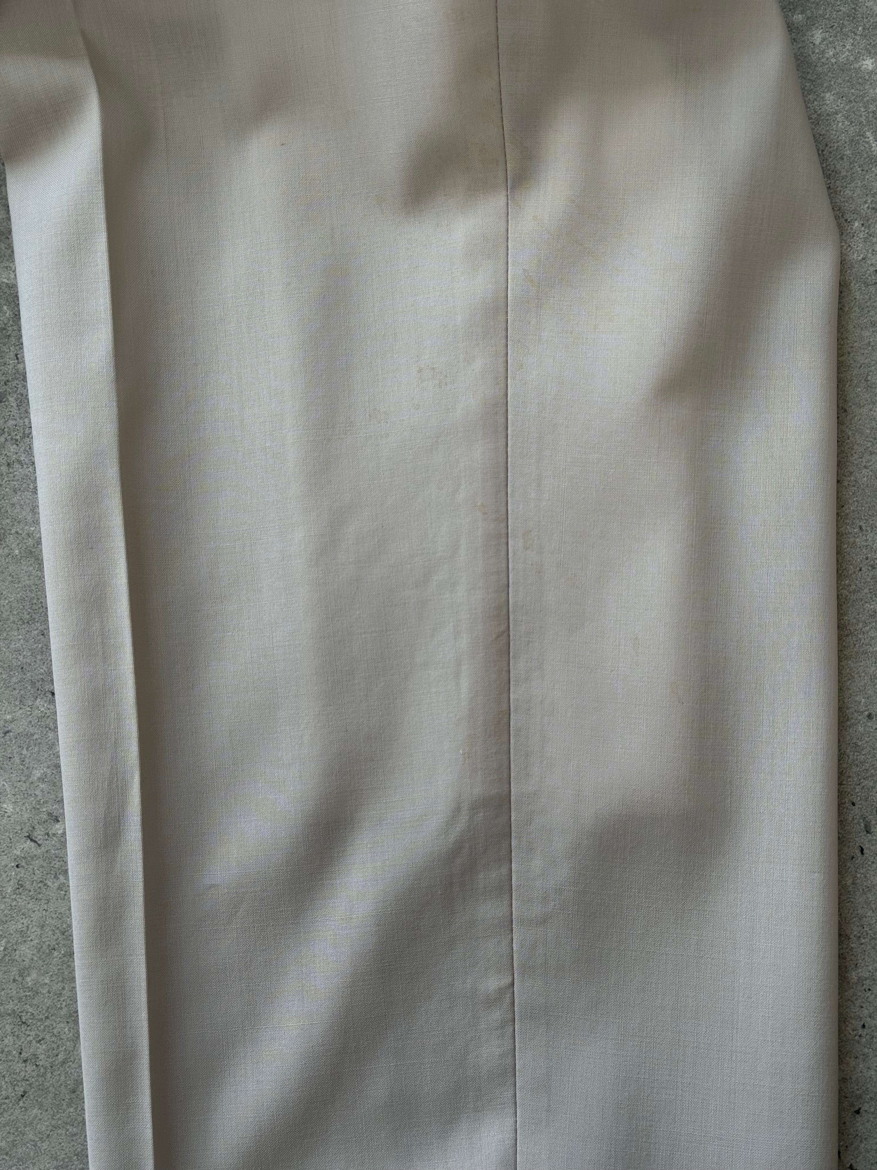 Hugo Boss 2000s pure wool single-breasted suit in size 40R/W34, tailored fit, classic dark color, displayed on a hanger.
