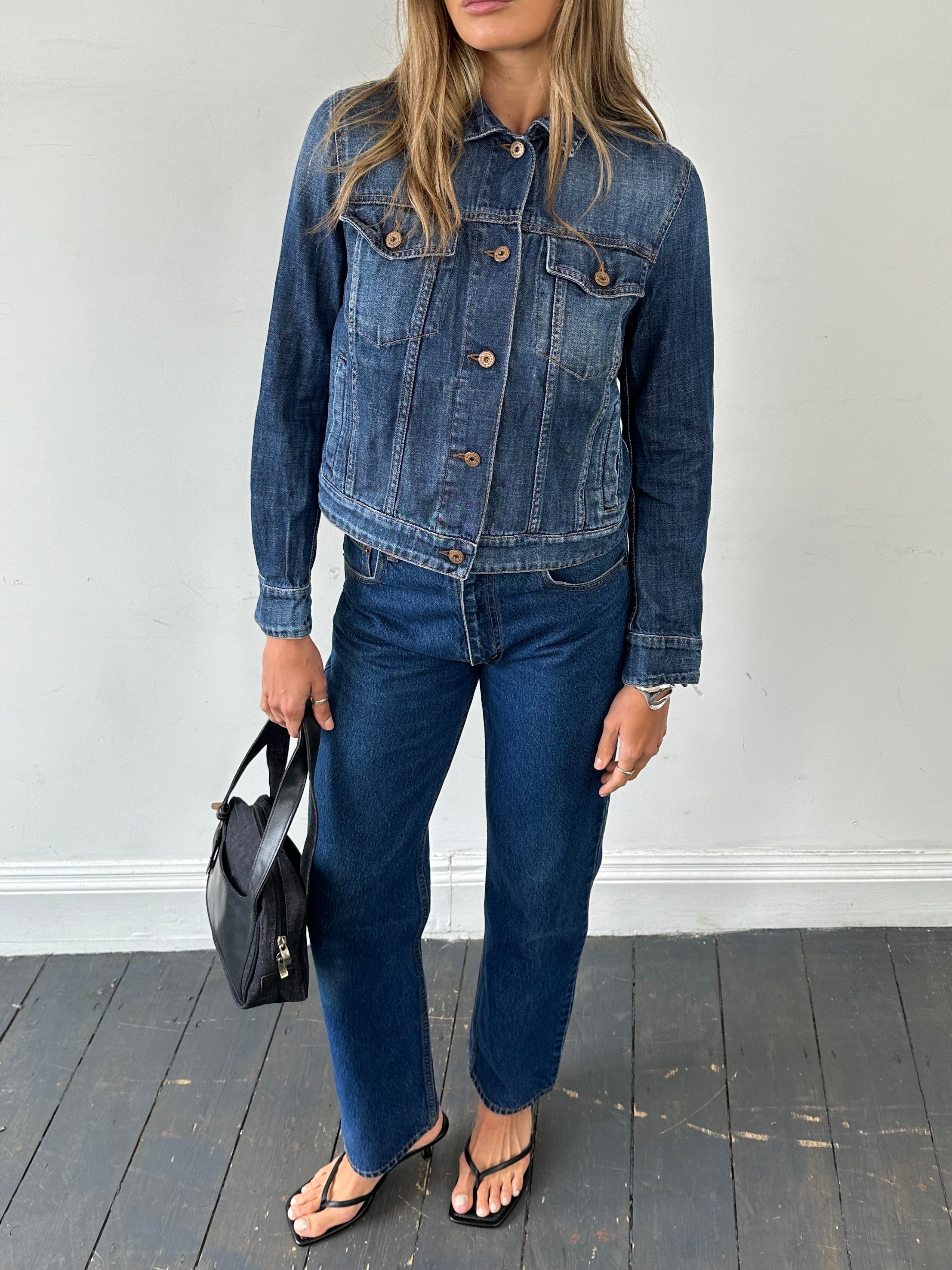 Vintage pure cotton straight leg denim jeans in size W28, shown folded with visible stitching and classic five-pocket design.
