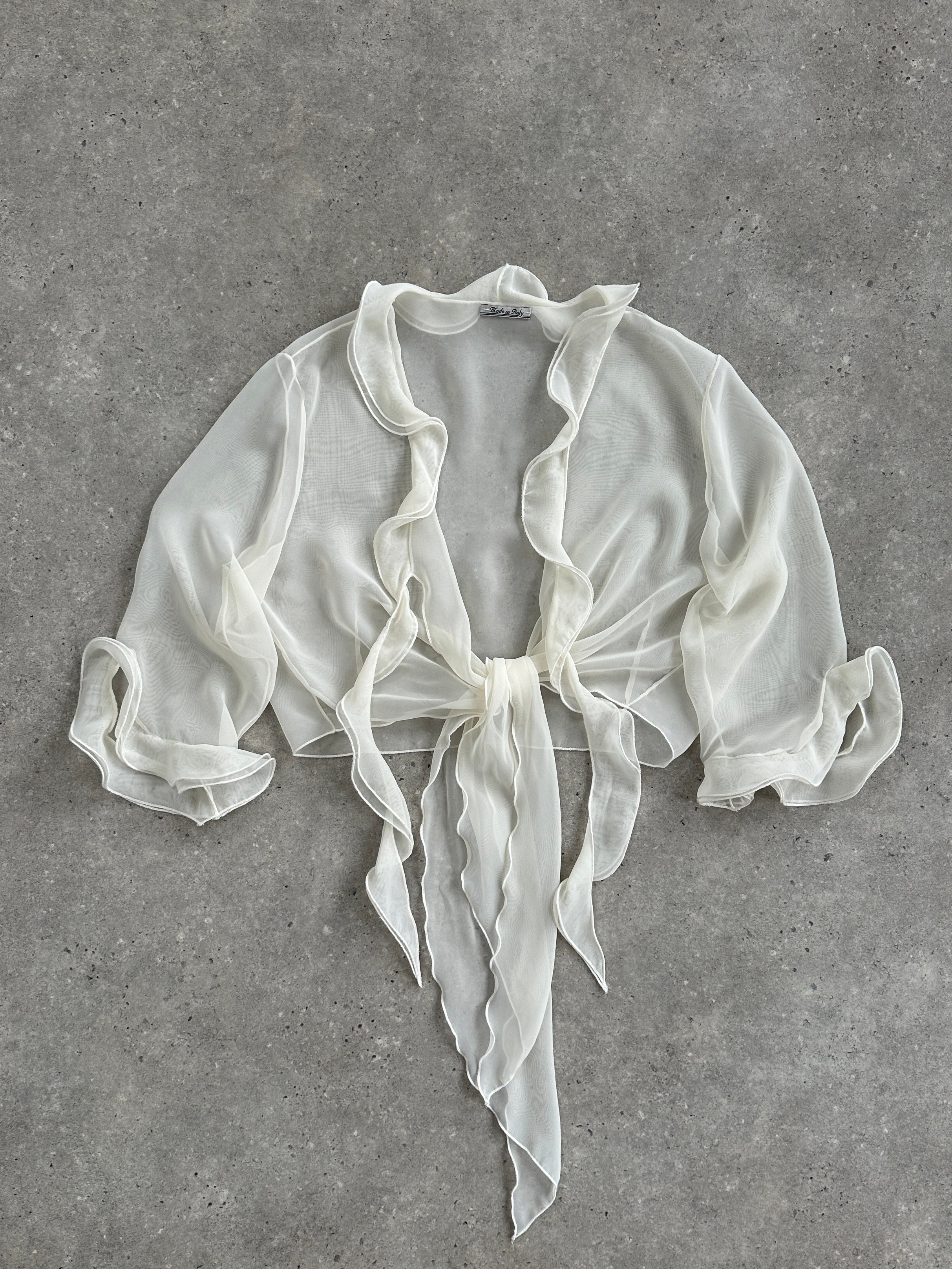 Vintage Italian sheer frill tie-front blouse, available in S to XL, featuring delicate fabric and feminine design details.