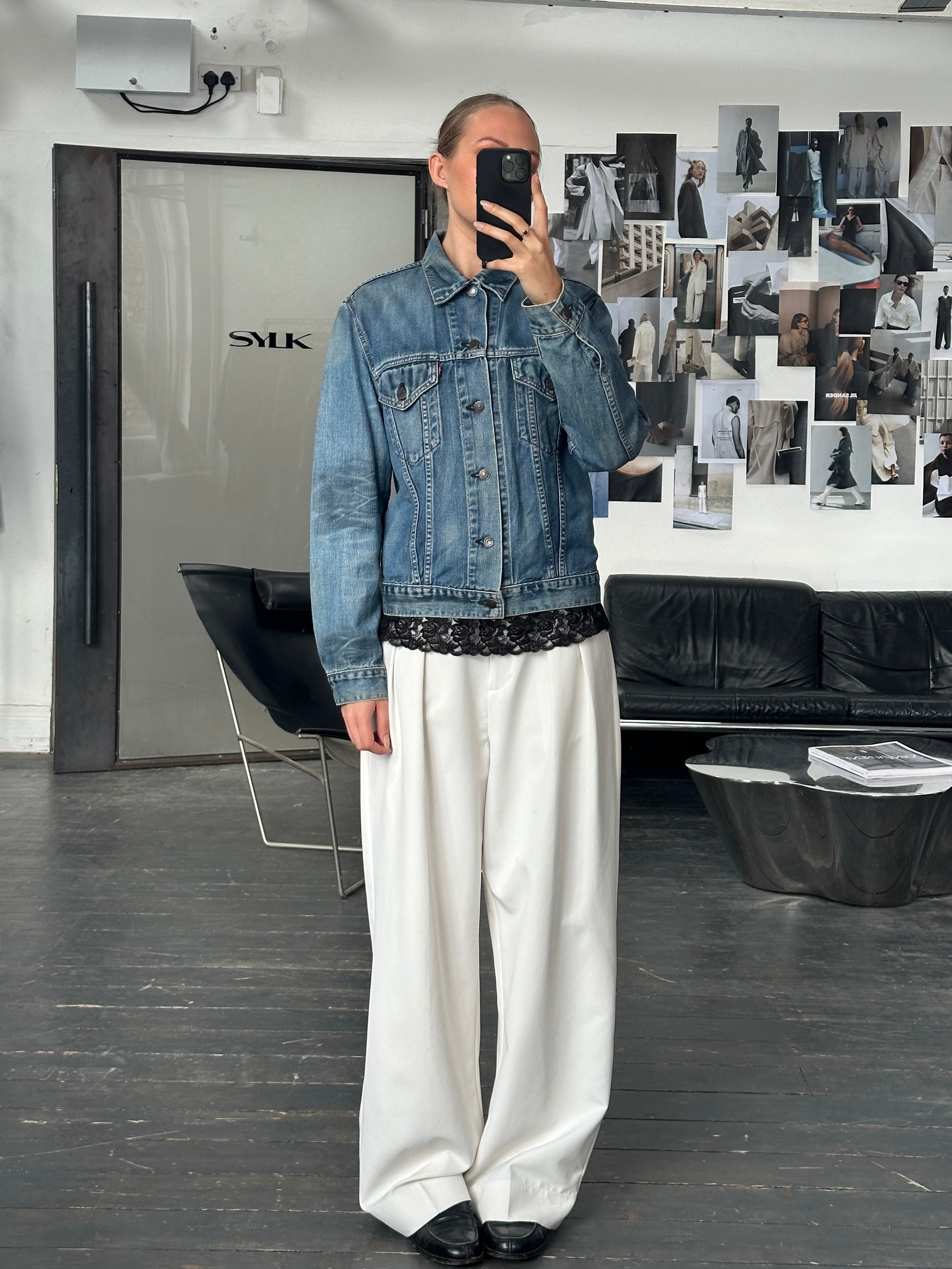 Levi’s 1990s faded denim jacket, men's medium size, showcasing distressed light-wash denim with classic design details.