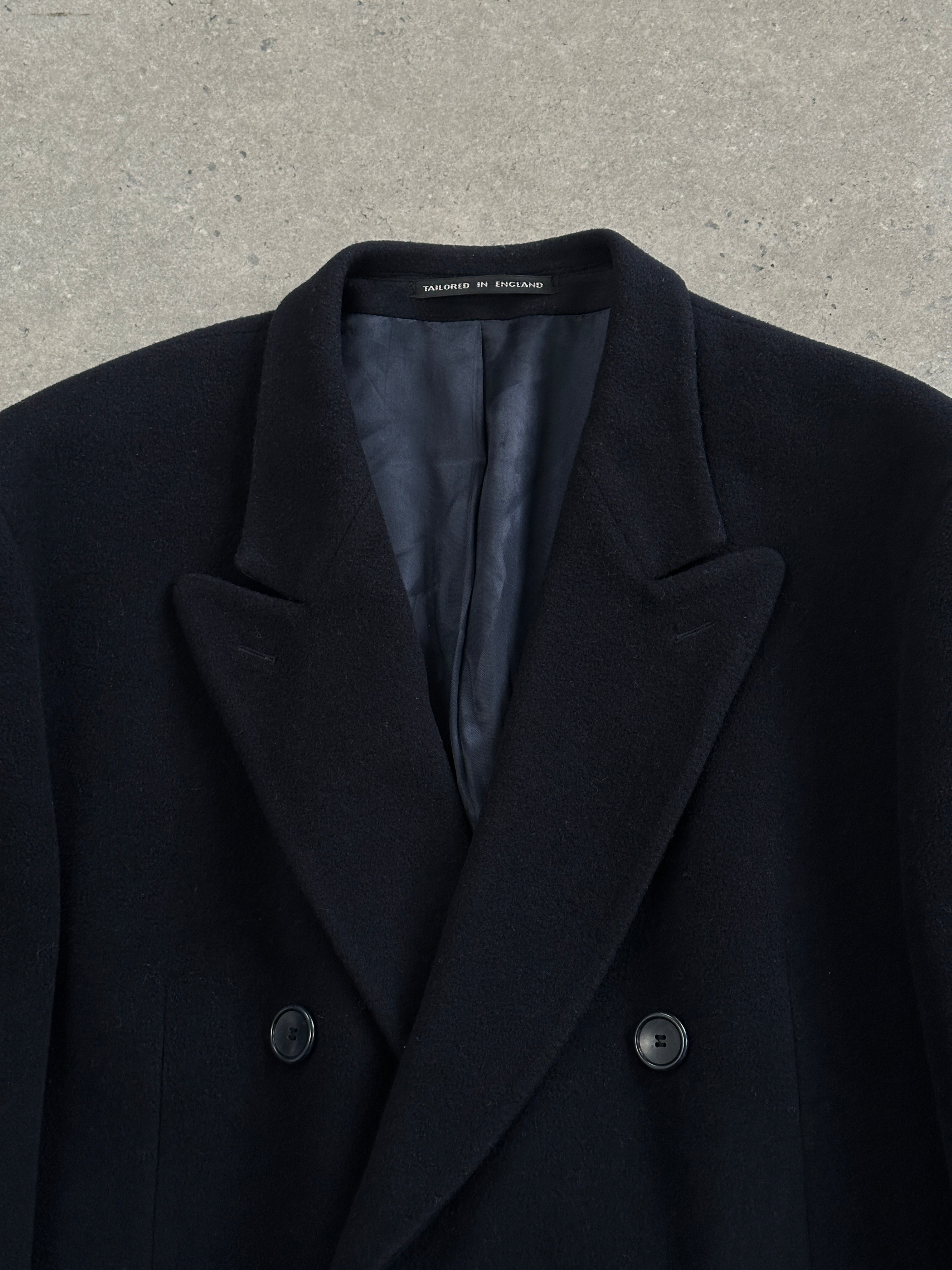 Vintage 1990s wool cashmere double-breasted coat in XXL, featuring classic design and tailored fit, shown on a hanger.