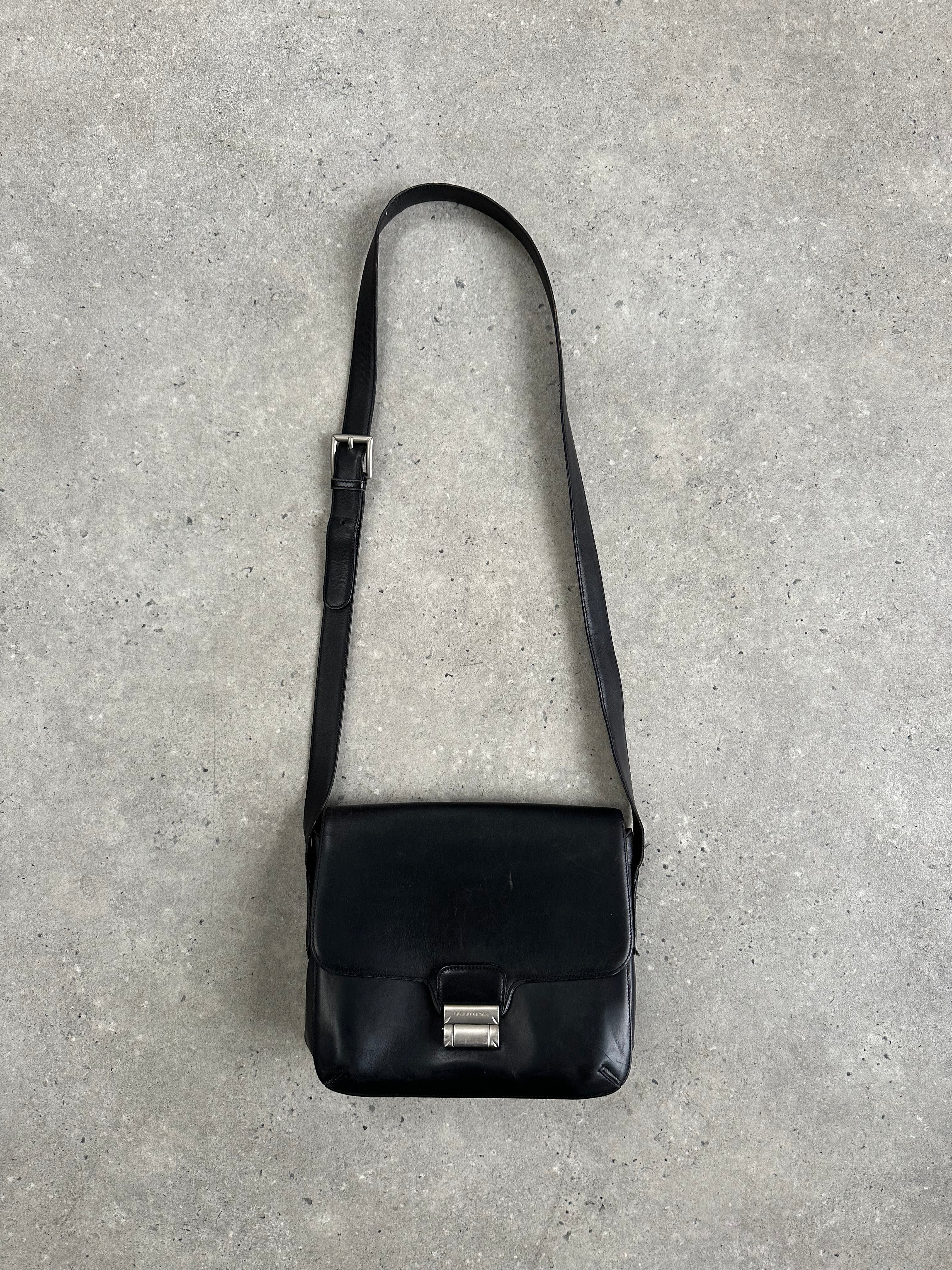 Giorgio Armani Le Collezioni leather crossbody bag with sleek design and adjustable strap, crafted in high-quality leather.