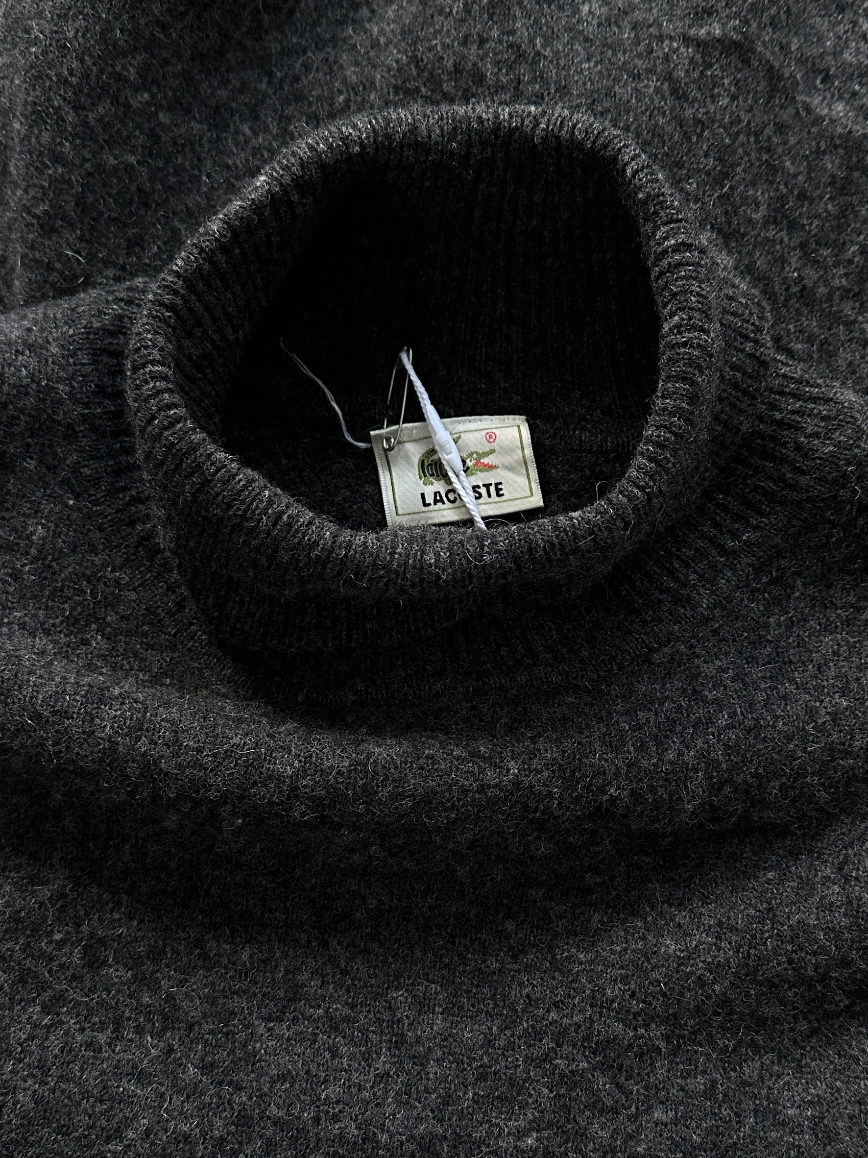 Lacoste pure wool roll neck jumper in size M, featuring a classic knit design and Lacoste logo on the chest.