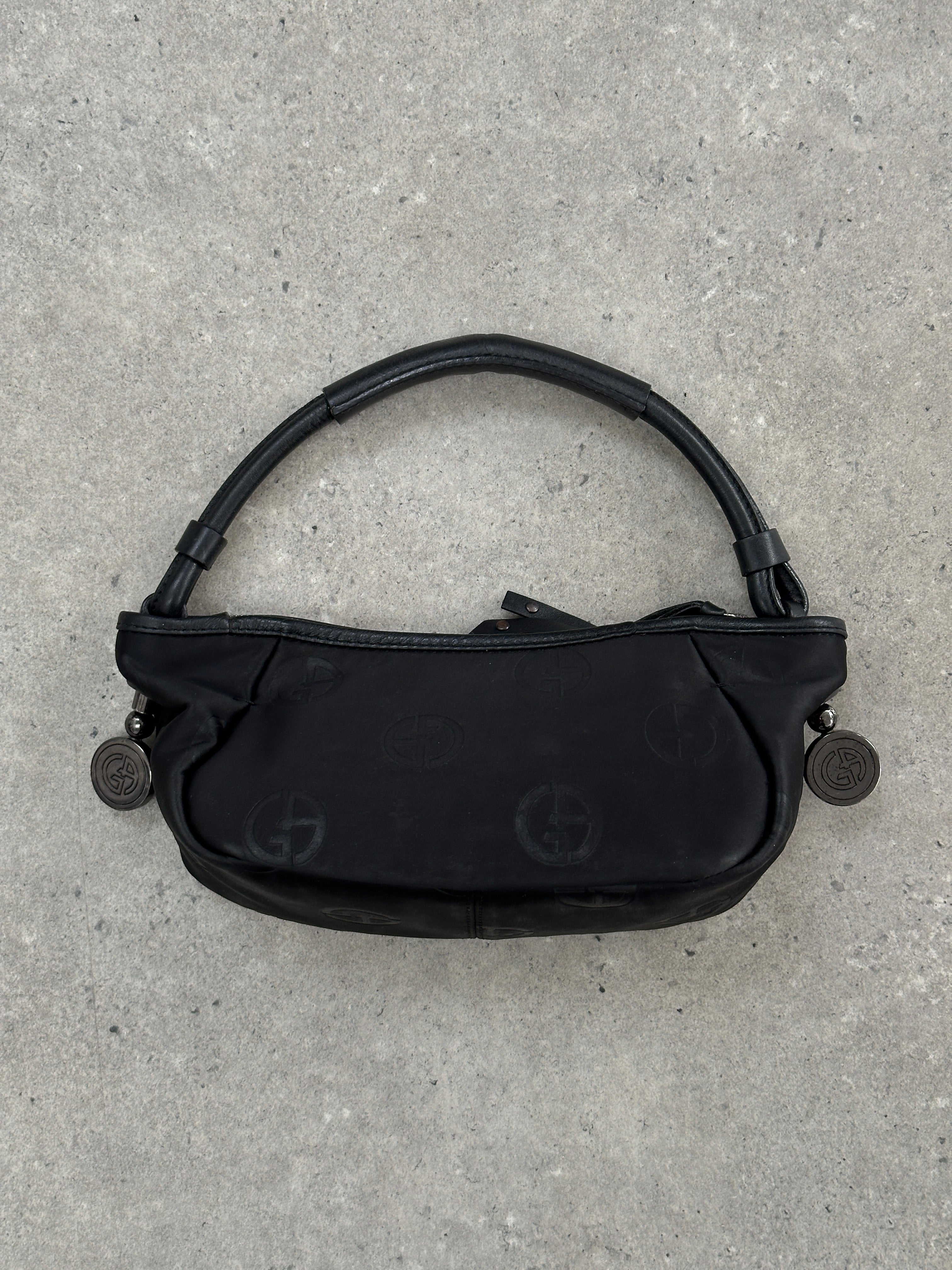 Giorgio Armani 2000s GA Monogram Baguette Bag with structured leather design and signature monogram pattern.