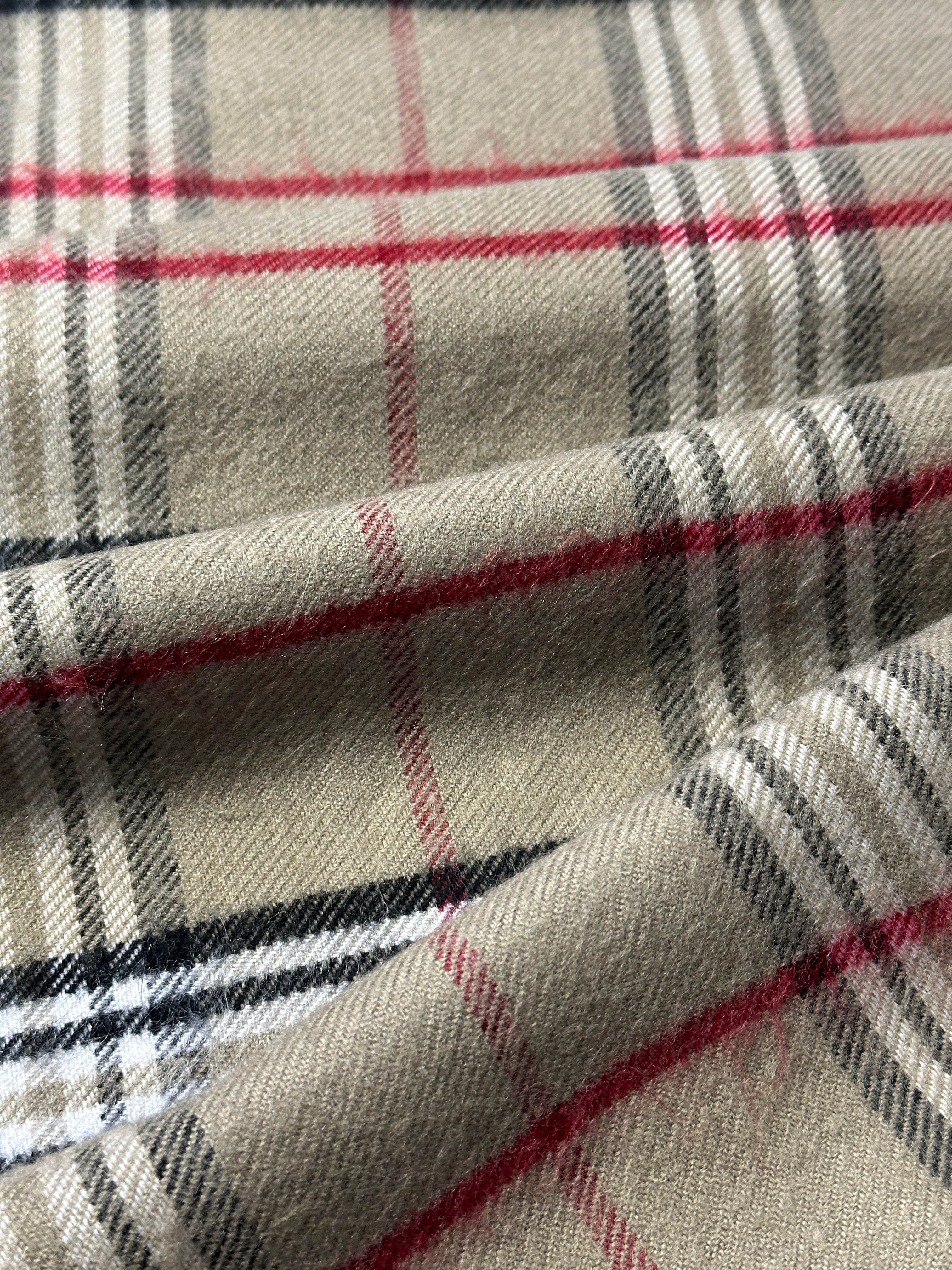 Vintage check tassel scarf with fringe, lightweight fabric, and classic pattern, perfect for stylish layering and accessorizing.