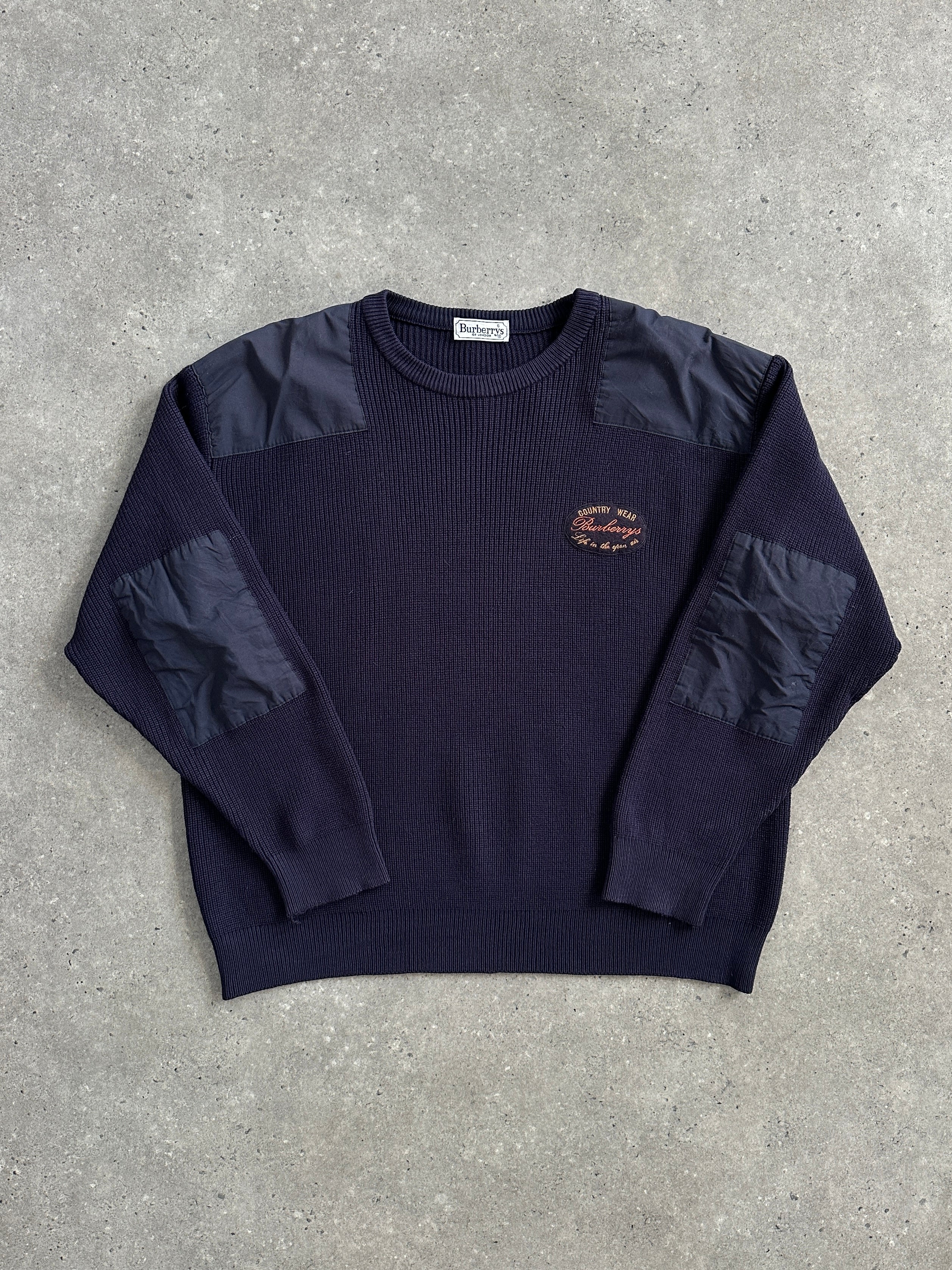 Burberry 1990s chunky knitted shoulder patch jumper in XL, featuring classic pattern and textured knit fabric.