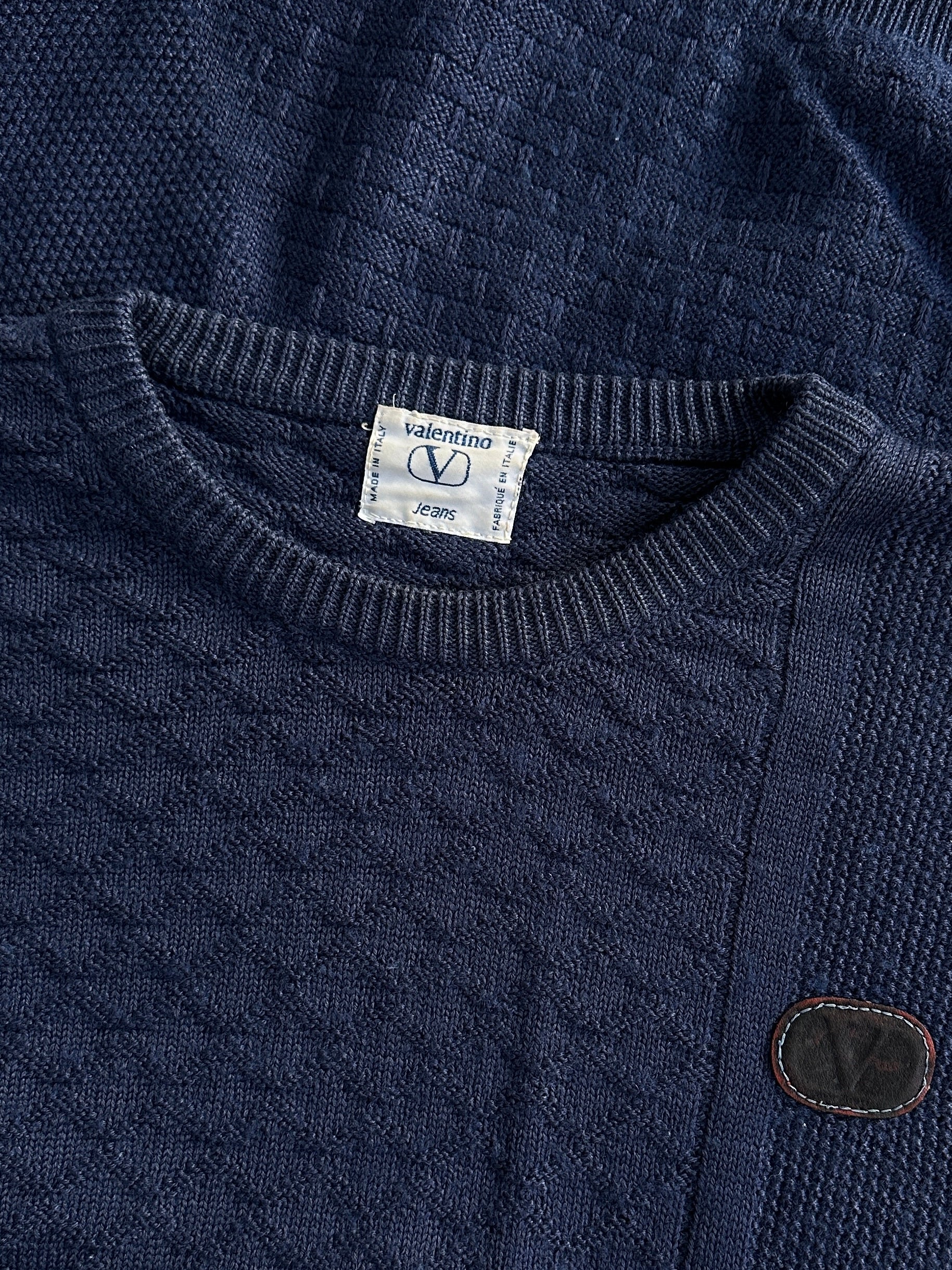 Valentino 1990s cotton cable knit logo jumper in black, featuring classic knit pattern and Valentino branding, size M/L.