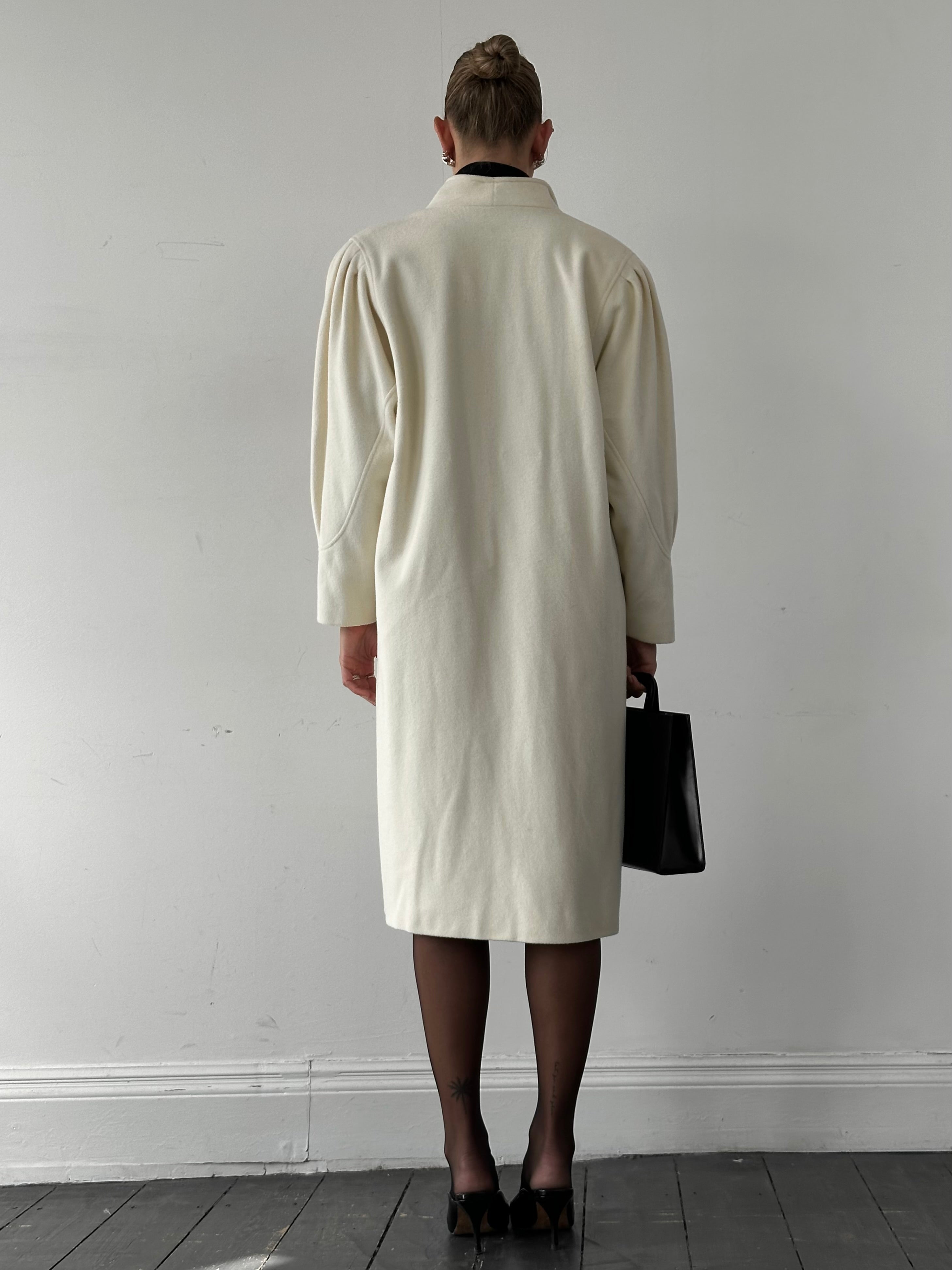 Vintage pure wool double-breasted coat in size L/XL, featuring classic design and textured fabric, ideal for stylish winter wear.