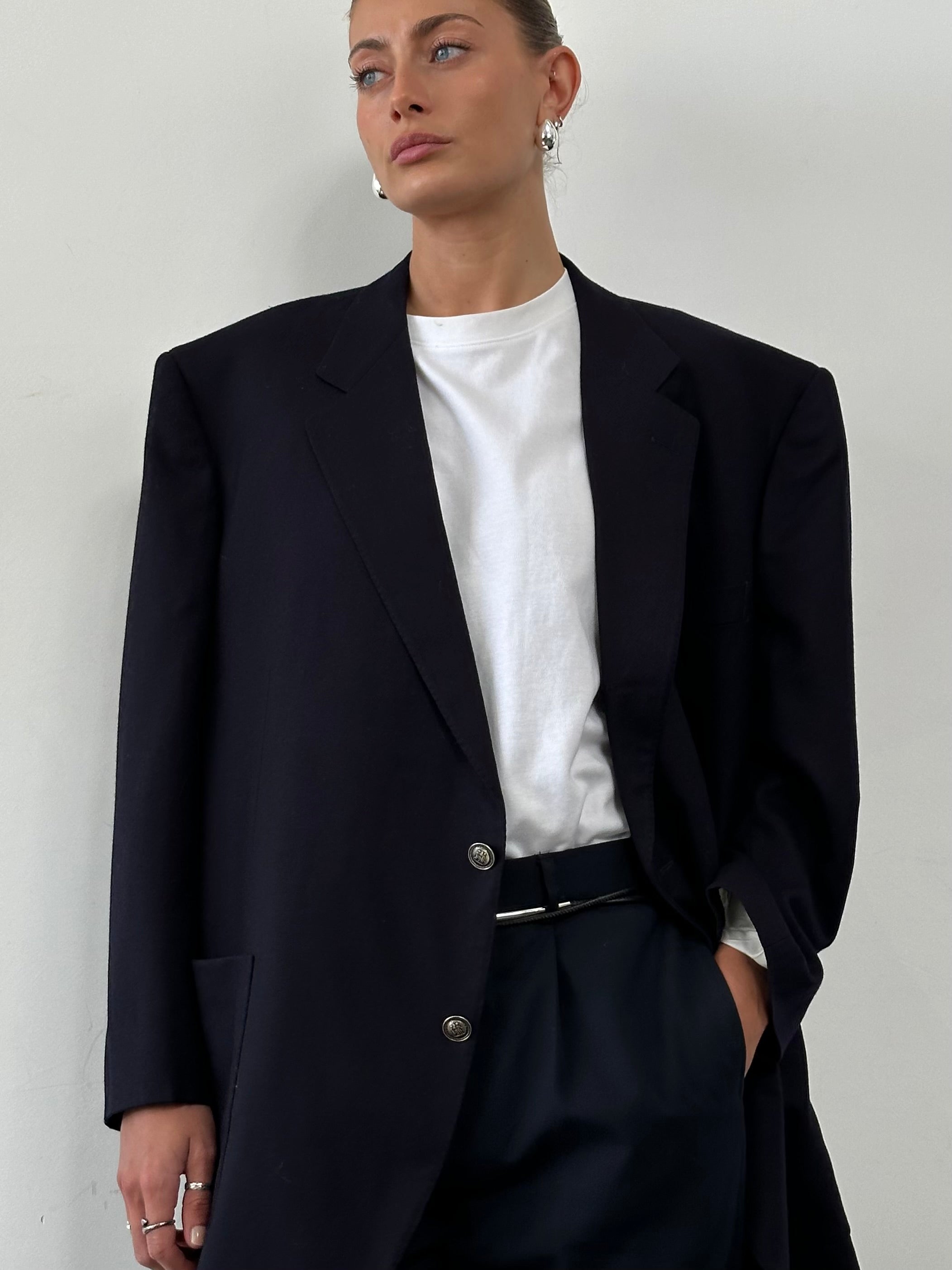 Christian Dior XXL brushed wool blazer featuring bespoke hardware, tailored fit, and classic design with lapel collar and front button closure.