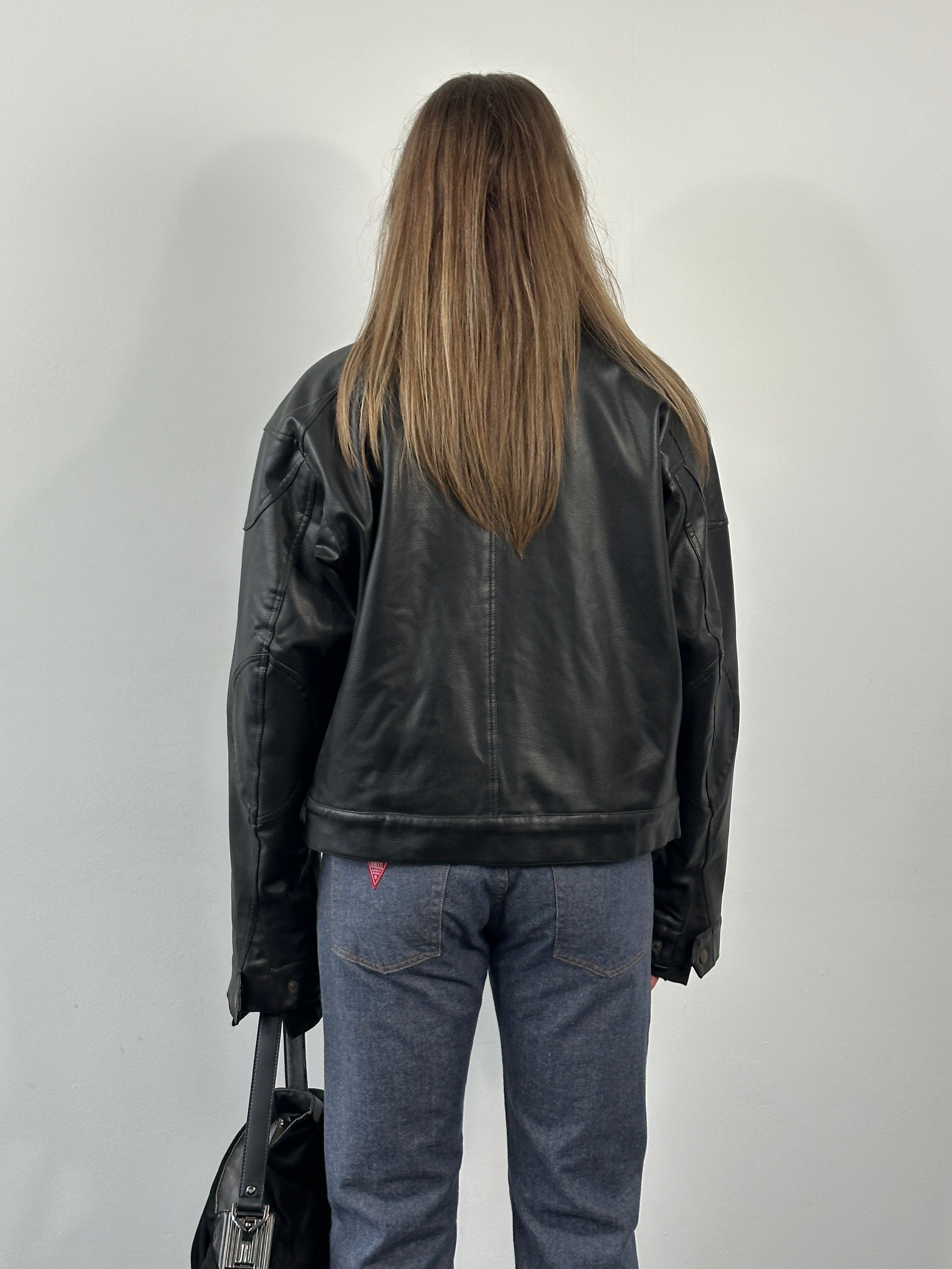 Vintage 1990s boxy faux leather jacket in size M, stylish retro leather jacket with a classic cropped fit.