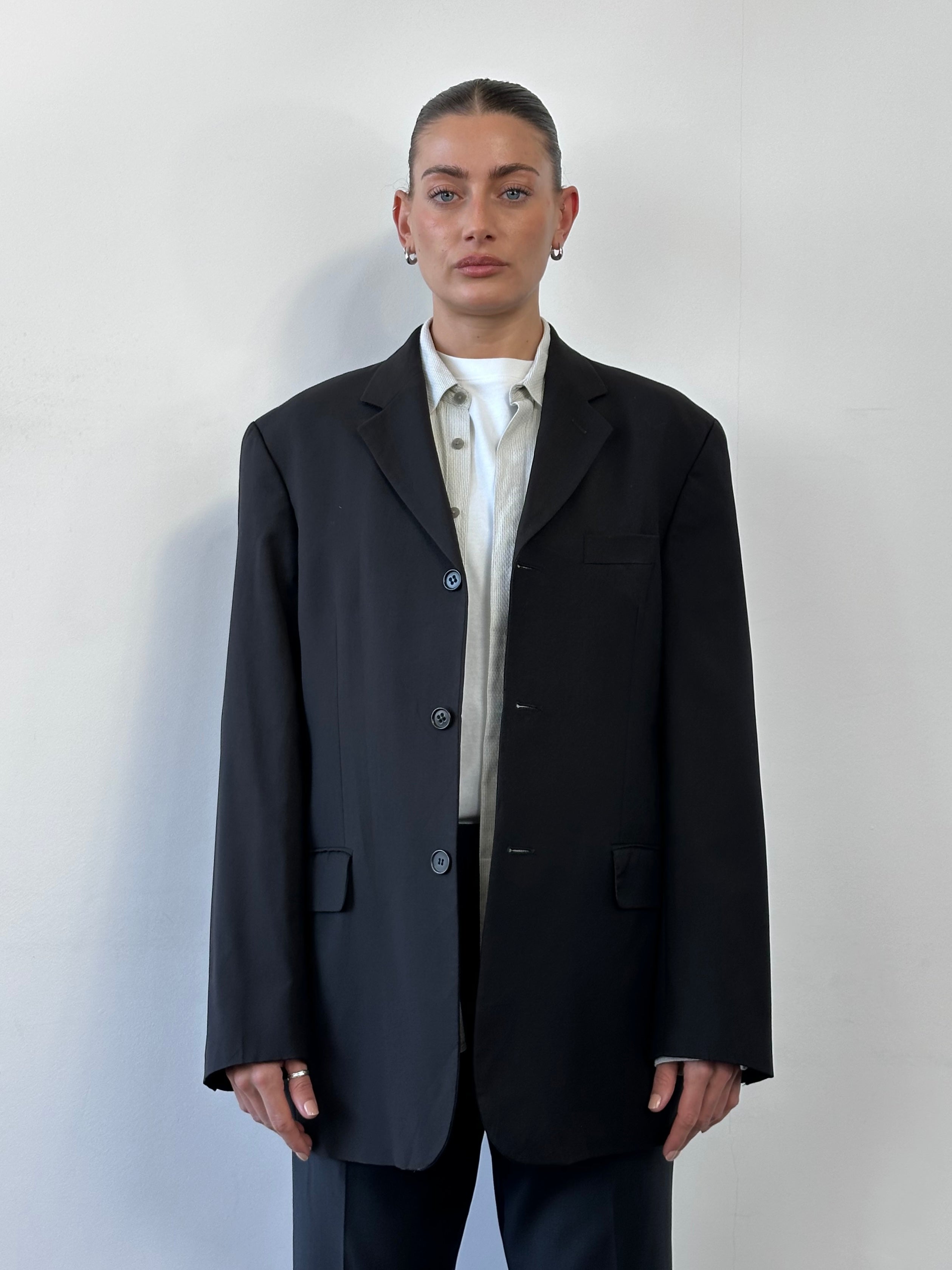 Yves Saint Laurent Pour Homme 1990s pure wool single-breasted blazer in size 42R/XL, dark tailored jacket with notch lapels.
