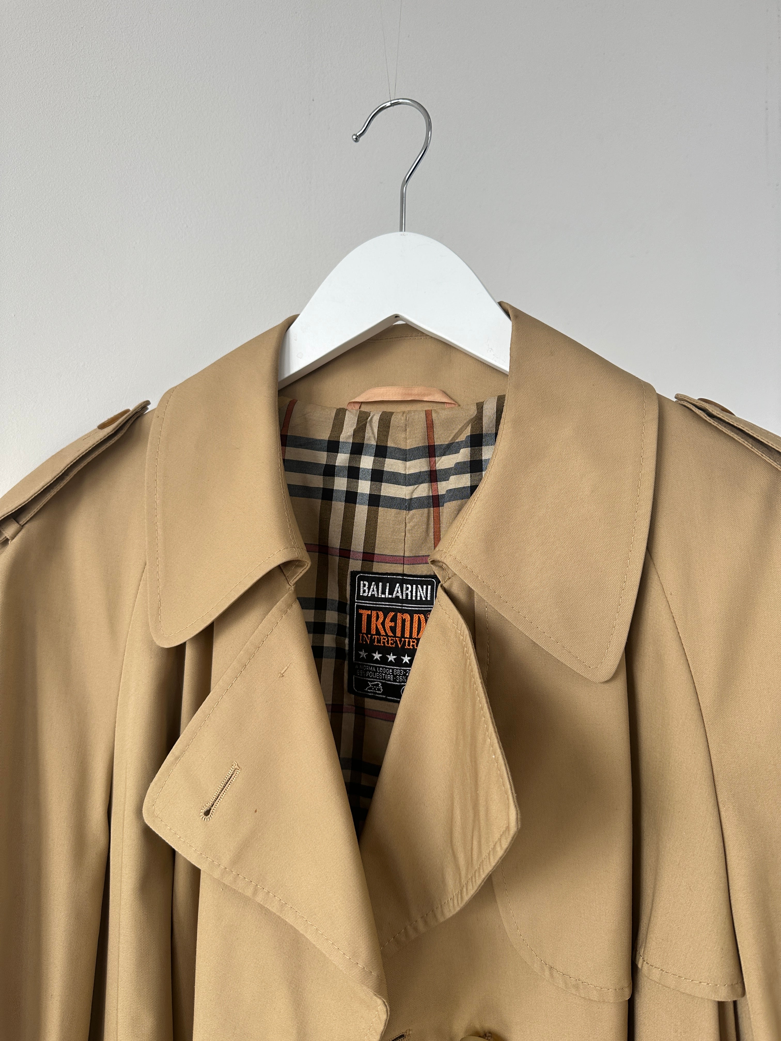 Vintage cotton double-breasted belted trench coat in size L, classic style with wide lapels and button details.