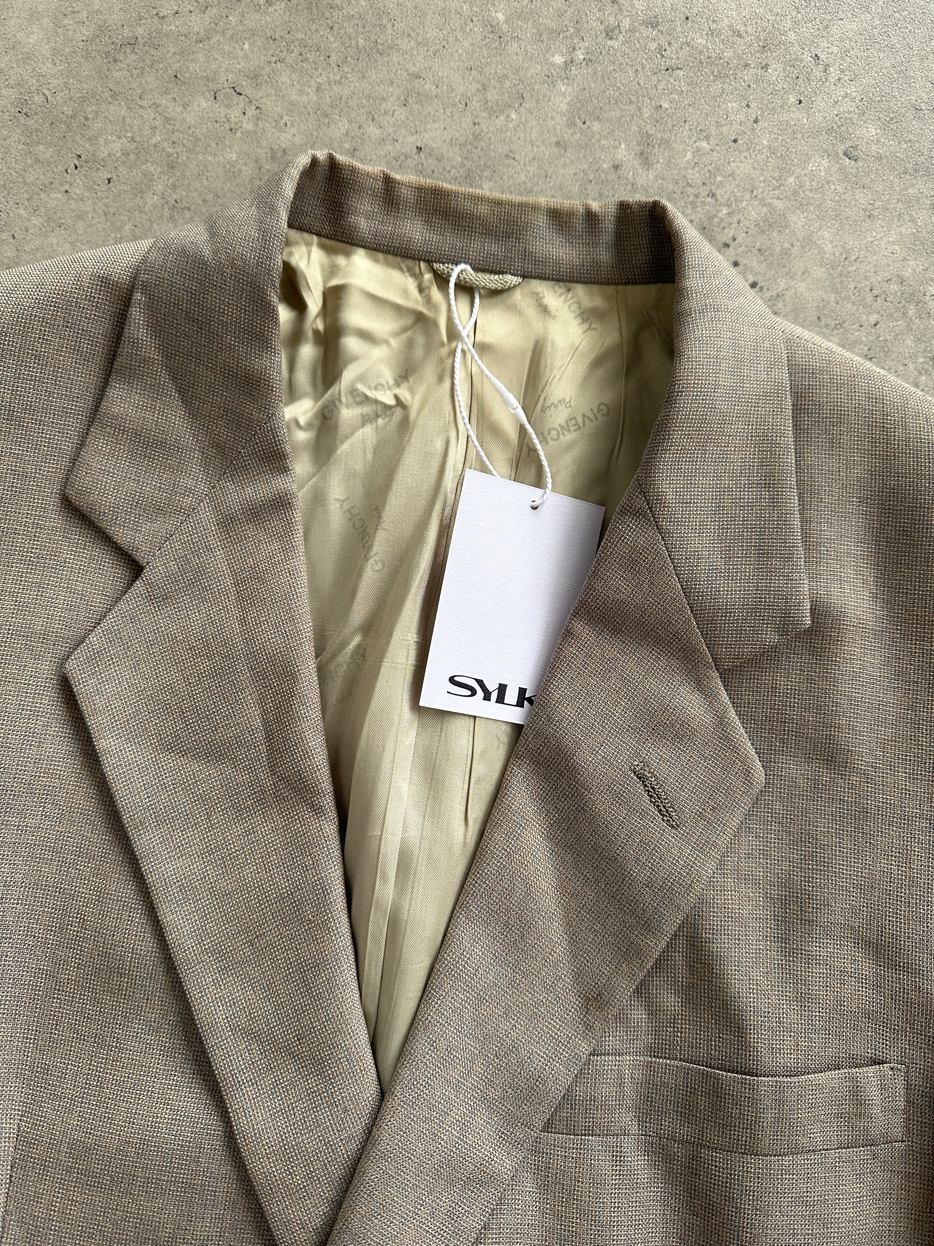 Givenchy wool single-breasted blazer in size M, tailored fit, navy color, with classic lapel and button closure.