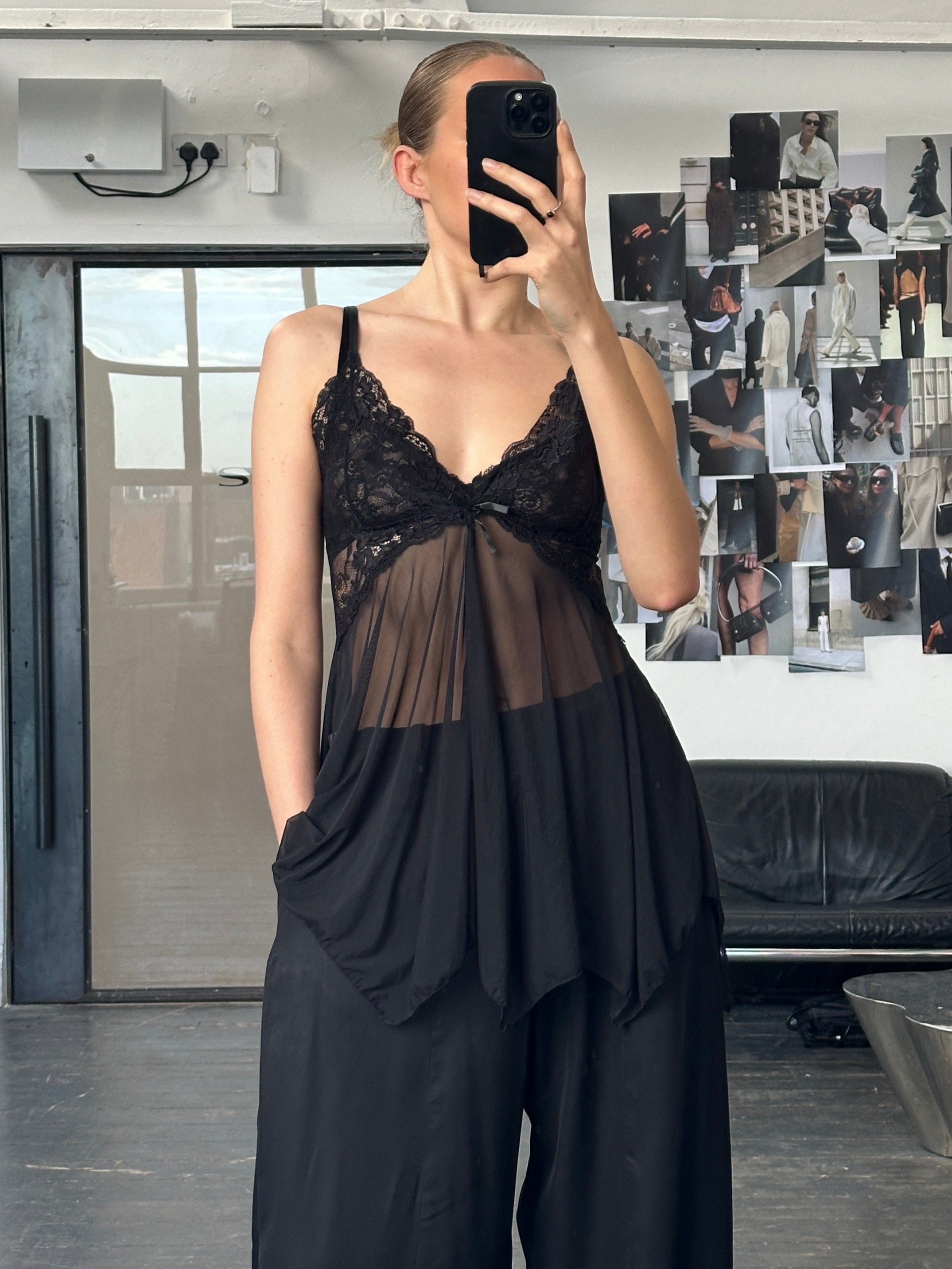 Vintage 1990s sheer lace mesh babydoll top, stylish and delicate, with intricate lace details, perfect for vintage fashion enthusiasts.