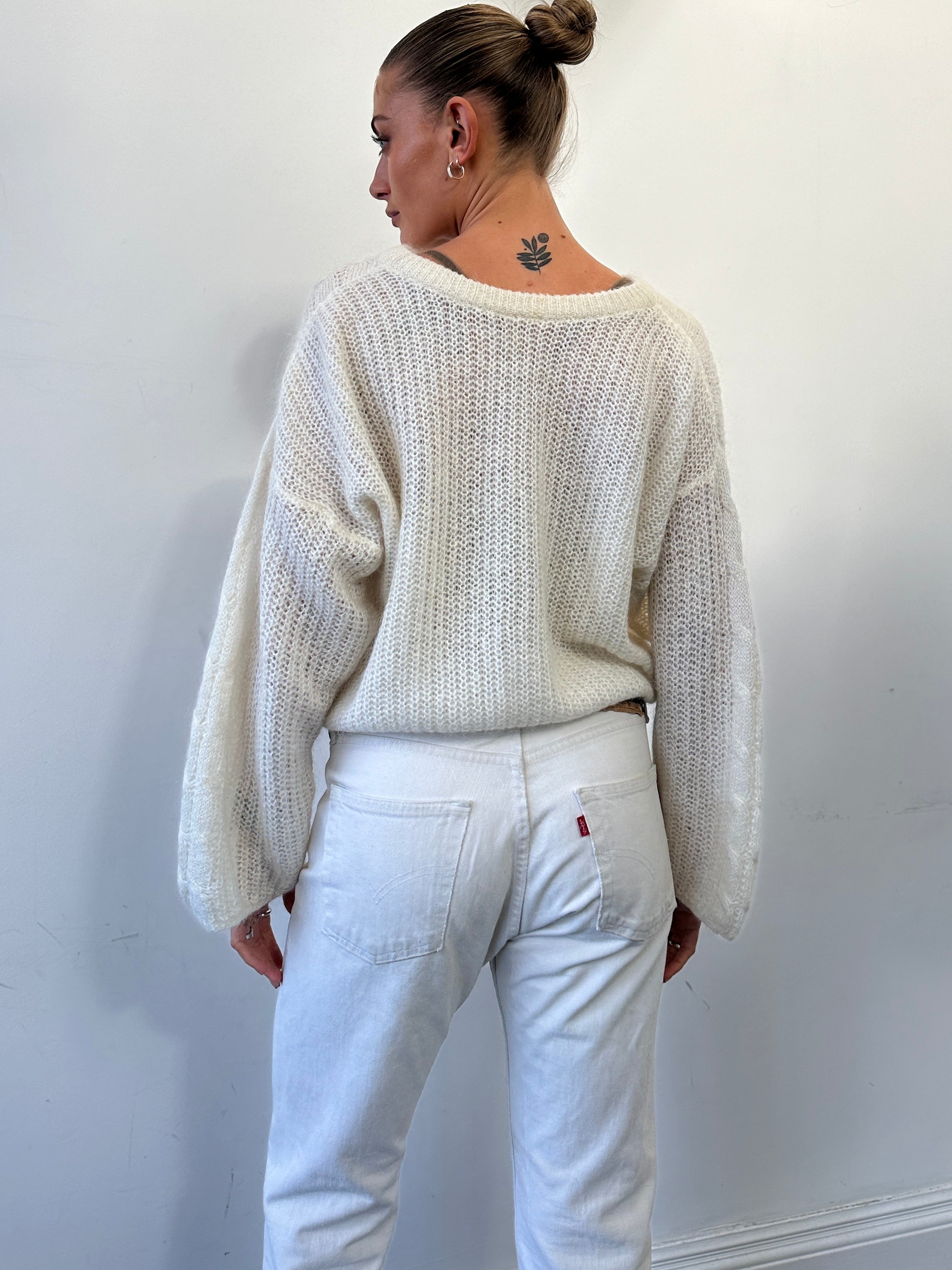 Vintage mohair open cable knit jumper in size M, featuring a cozy, textured design with a classic cable pattern and ribbed cuffs.