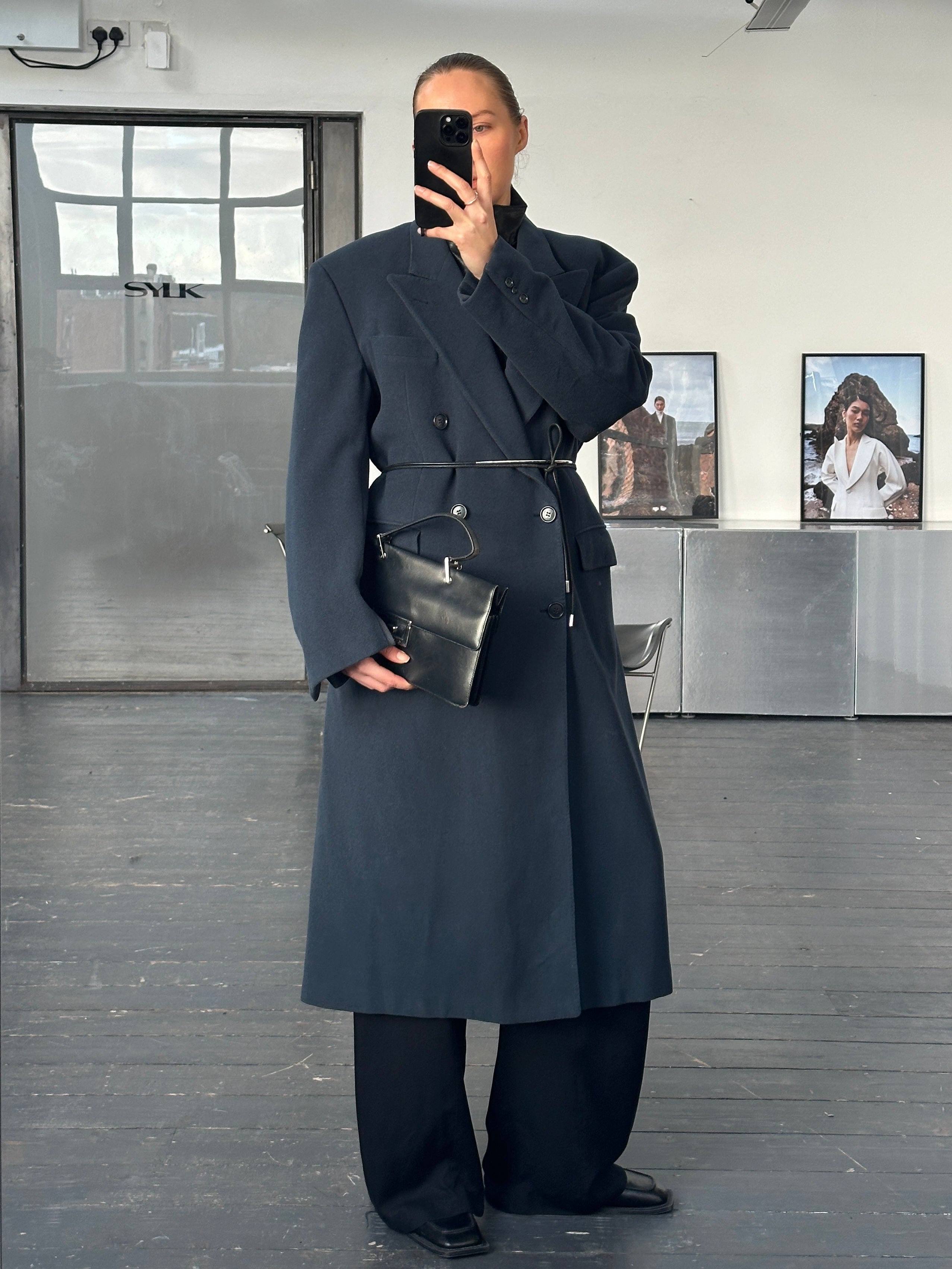Moschino 1990s pure wool double-breasted coat in XL/XXL, showing classic design and tailored fit in a neutral color.