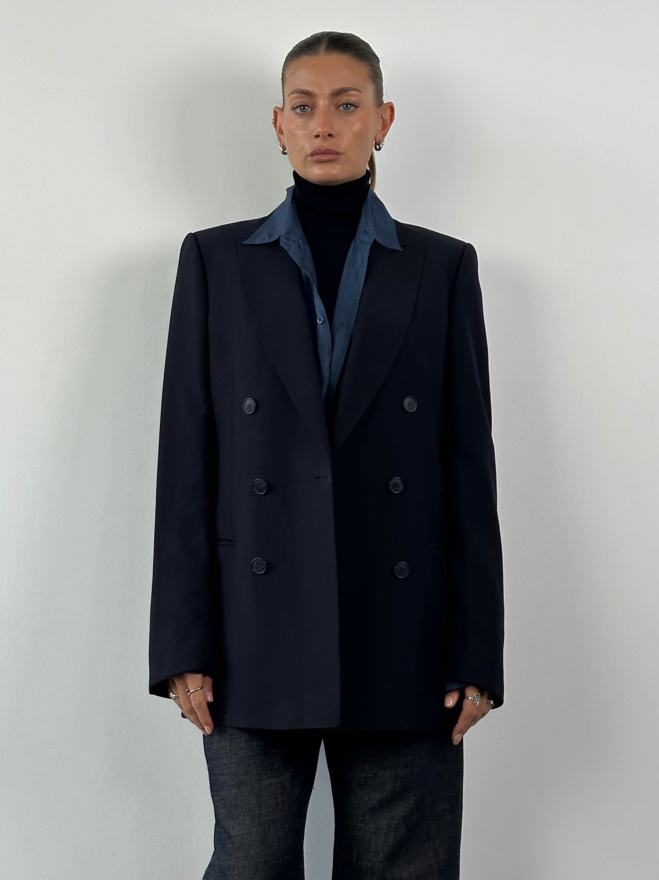 Vintage pure virgin wool double-breasted blazer in size L/XL, featuring classic tailored design and structured fit.