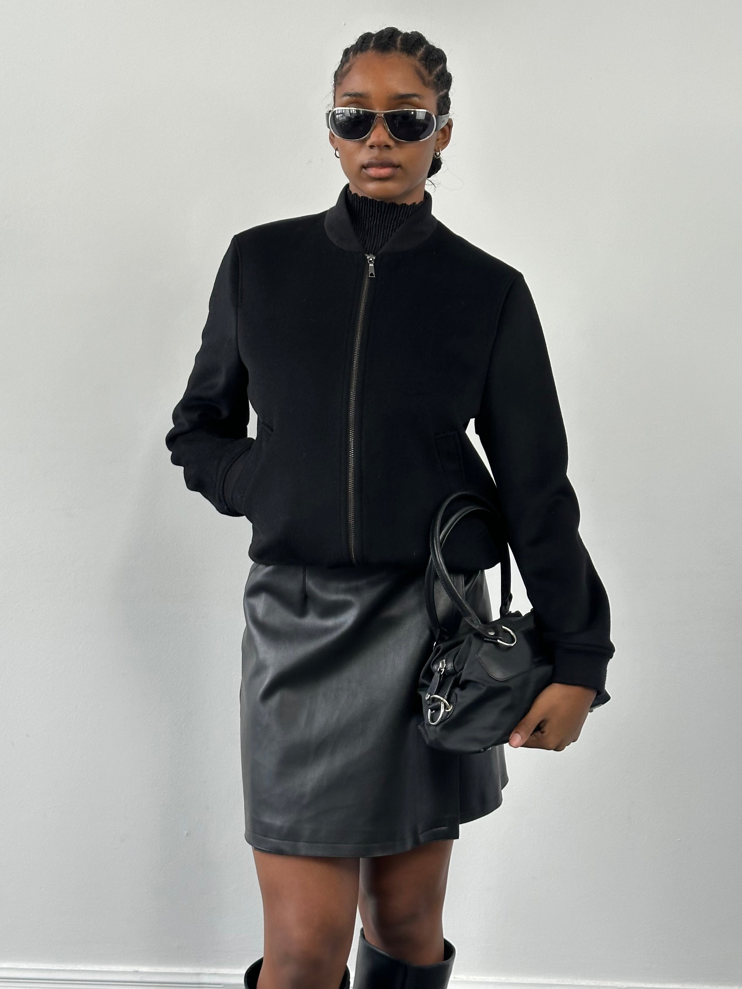 Jaeger minimal pure wool bomber jacket in size S, featuring a sleek design and classic silhouette, displayed on a hanger.
