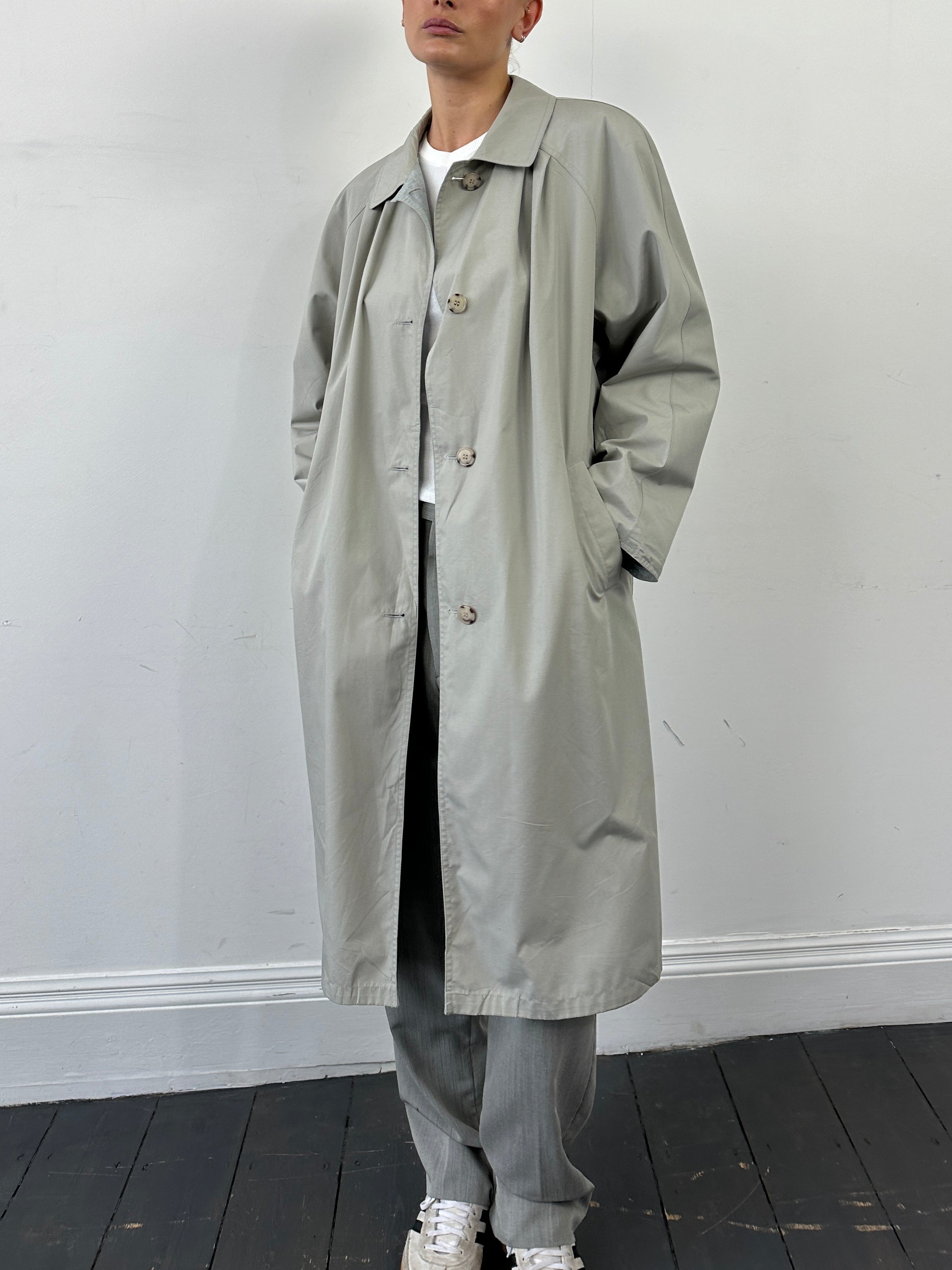 Vintage reversible showerproof check trench coat with belt, size large, featuring classic plaid pattern and waterproof fabric.