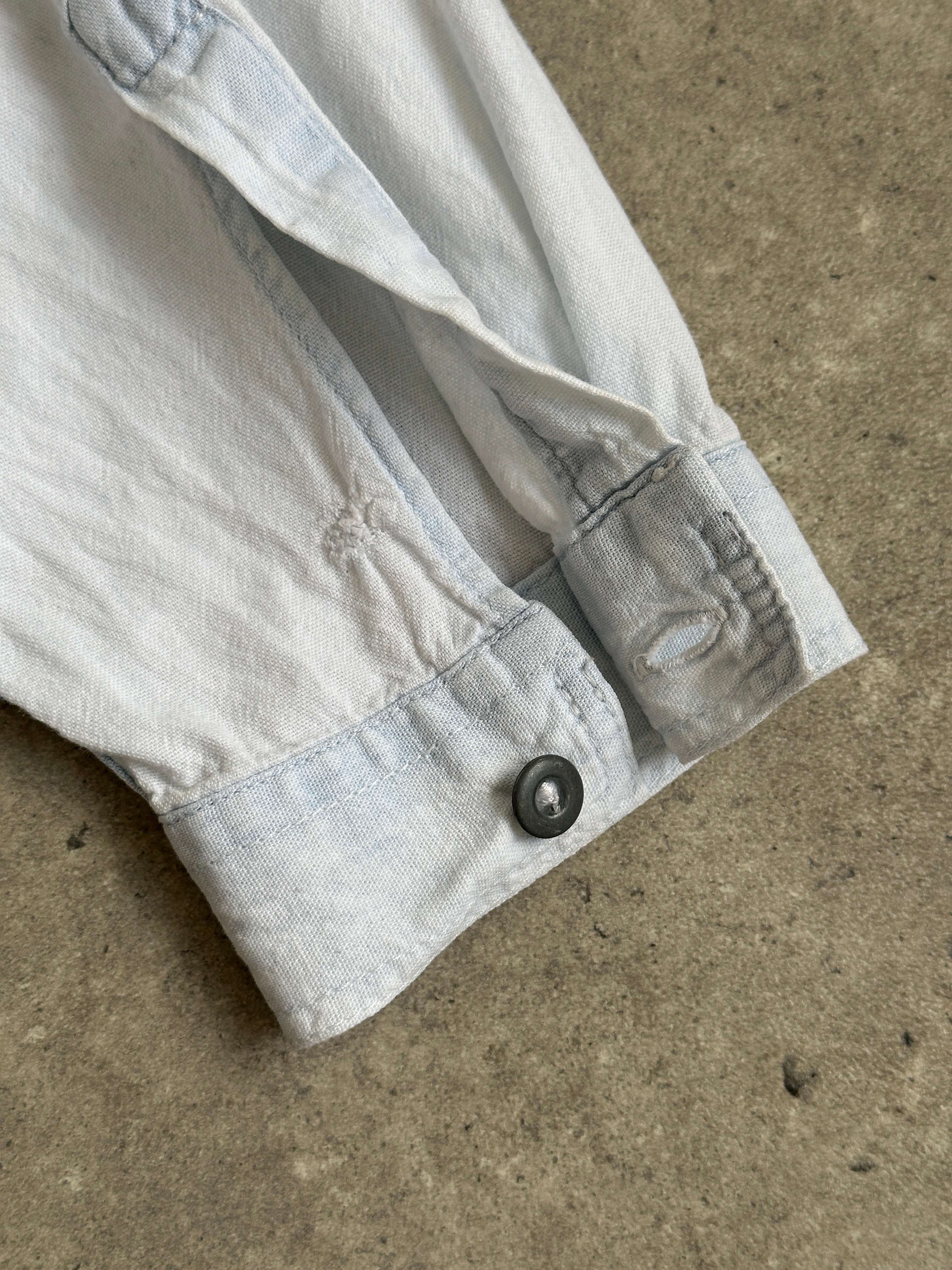 Armani Jeans light wash denim shirt in XL size, featuring classic button-up style and collar, made from soft denim fabric.