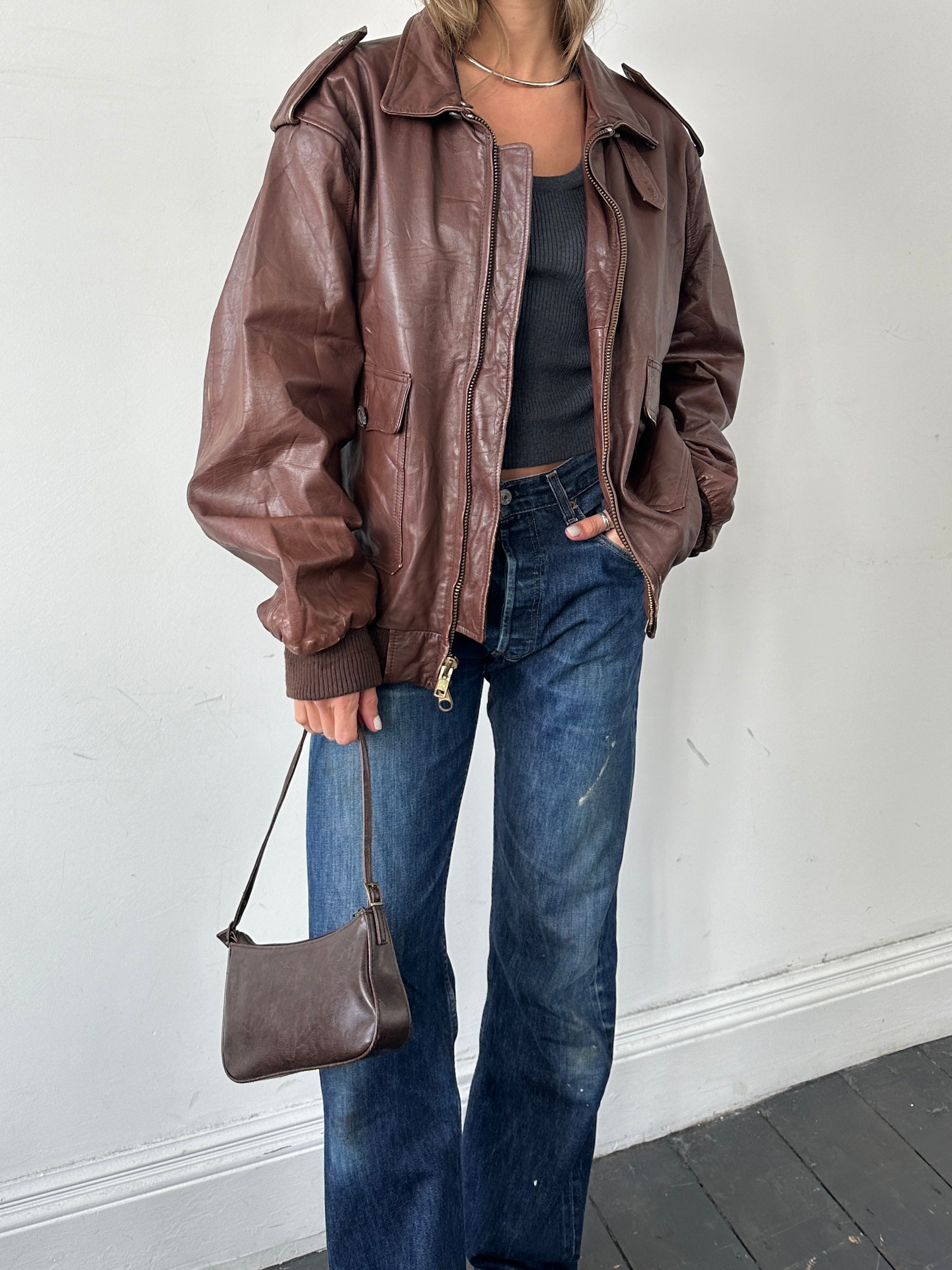 Vintage double zip leather bomber jacket in XL, featuring classic design and durable leather construction.