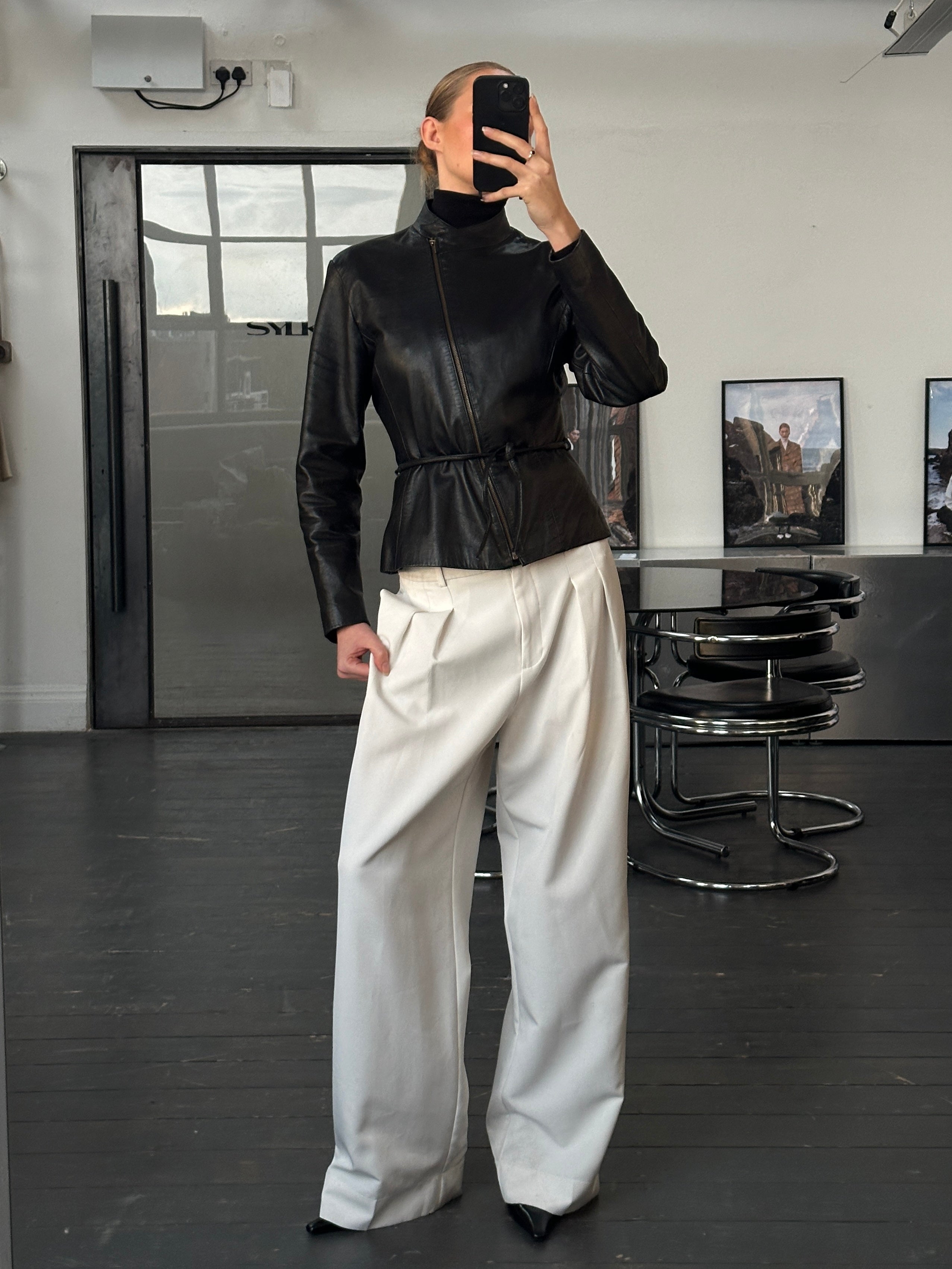 Vintage 2000s asymmetric leather jacket with tie belt, stylish vintage fashion in size small, featuring classic leather details.