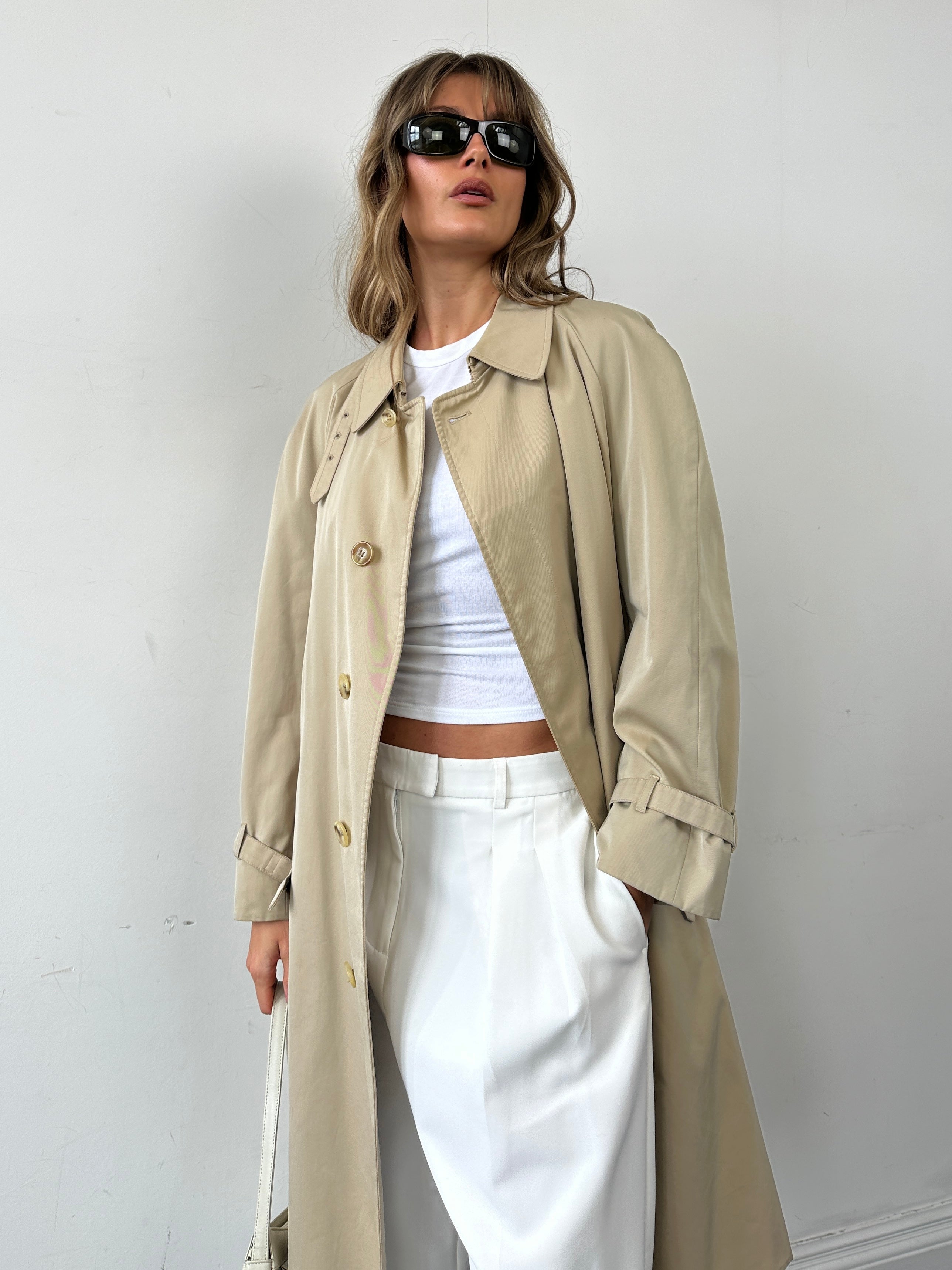 Aquascutum pure cotton trench coat with concealed placket and belt, shown in natural beige, size large, stylish and classic outerwear.