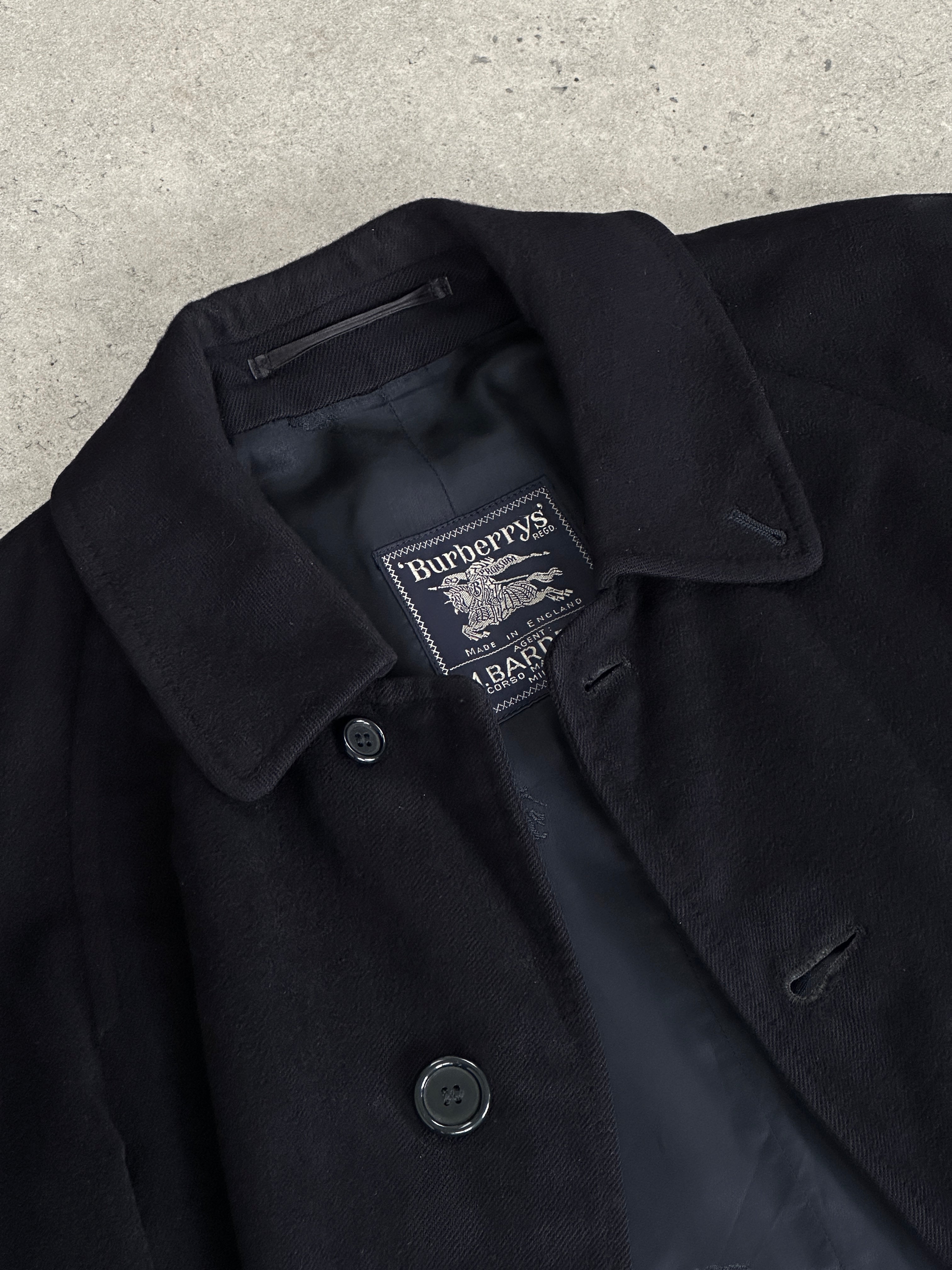 Burberry pure cashmere single-breasted coat in size L, displayed on a hanger with classic beige color and tailored fit.