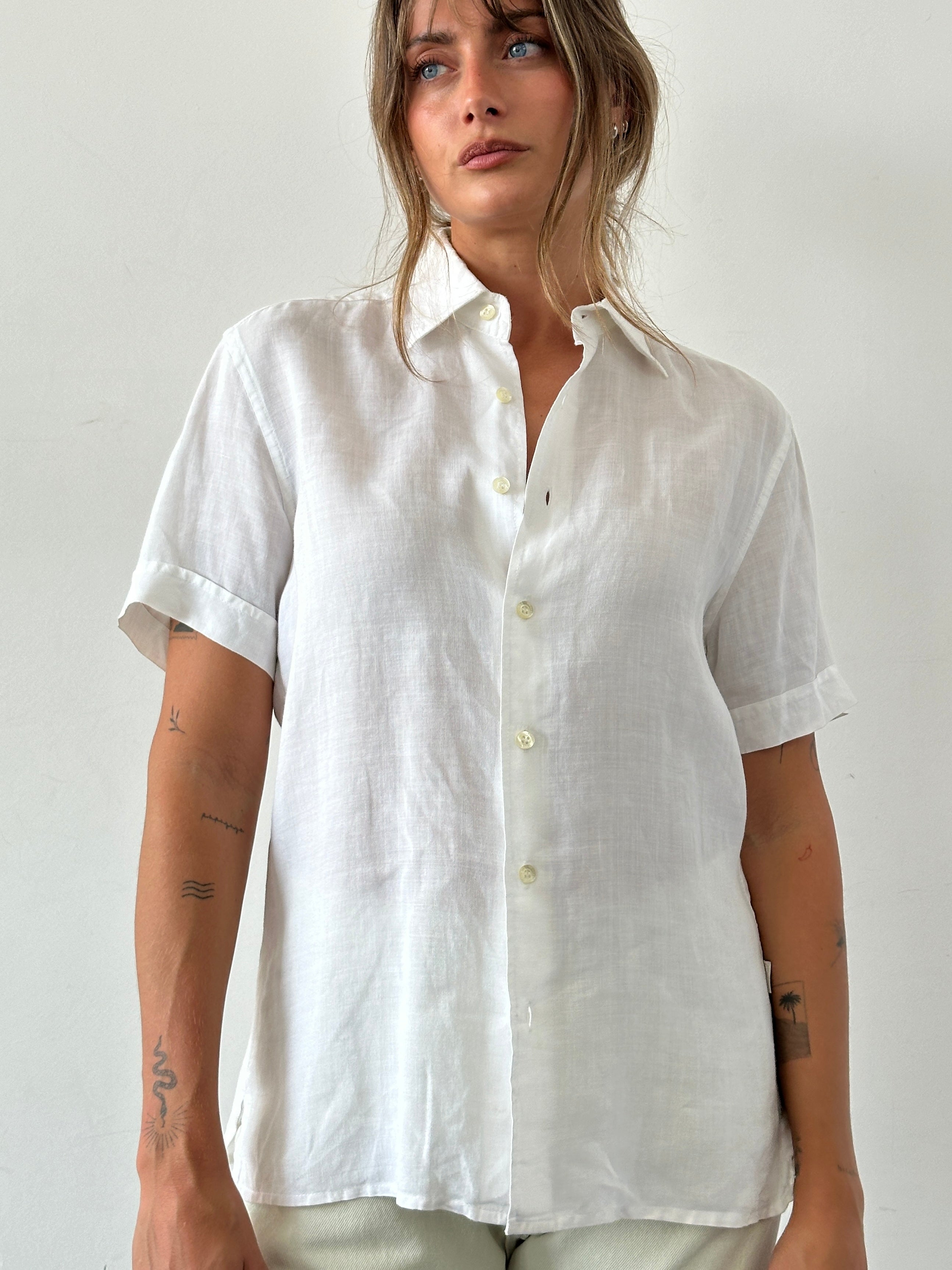 Guess Pure Linen Sheer Short Sleeve Shirt in white, lightweight and breathable, displayed on a hanger.