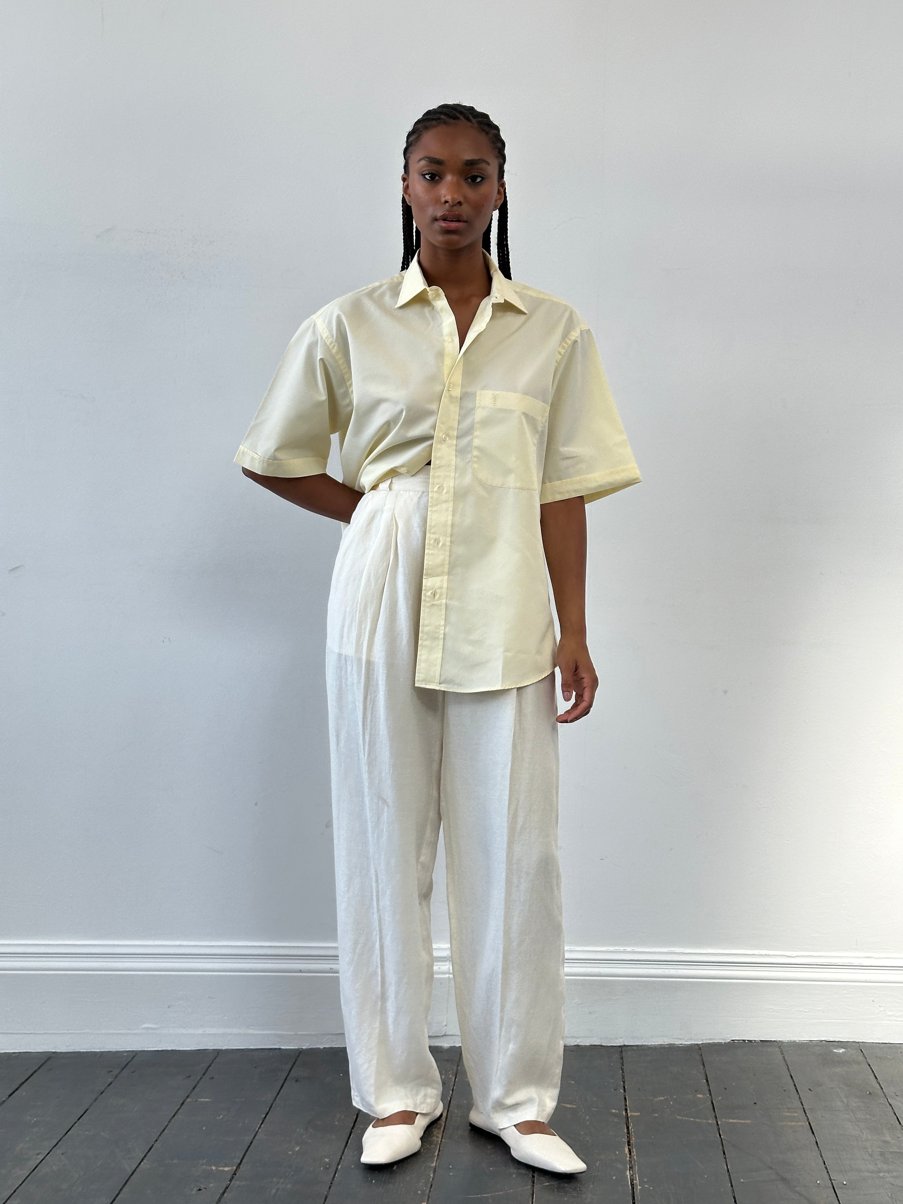 Versace 1980s silk linen high-waisted trousers in W22, showcasing elegant tailored design and luxurious fabric details.