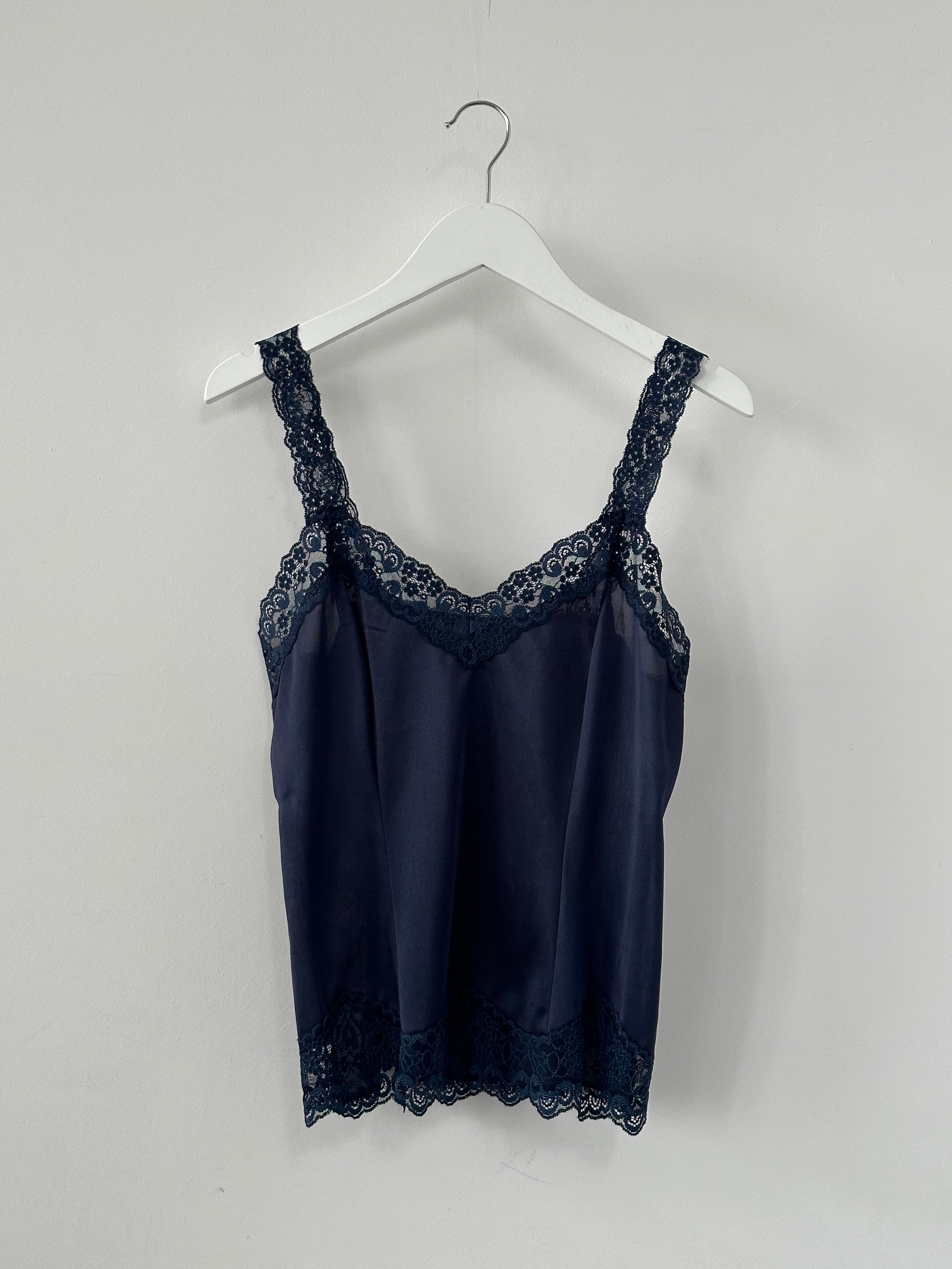 St Michael 90s satin lace cami top in XS, featuring delicate lace details and a sleek satin finish, shown on a hanger.