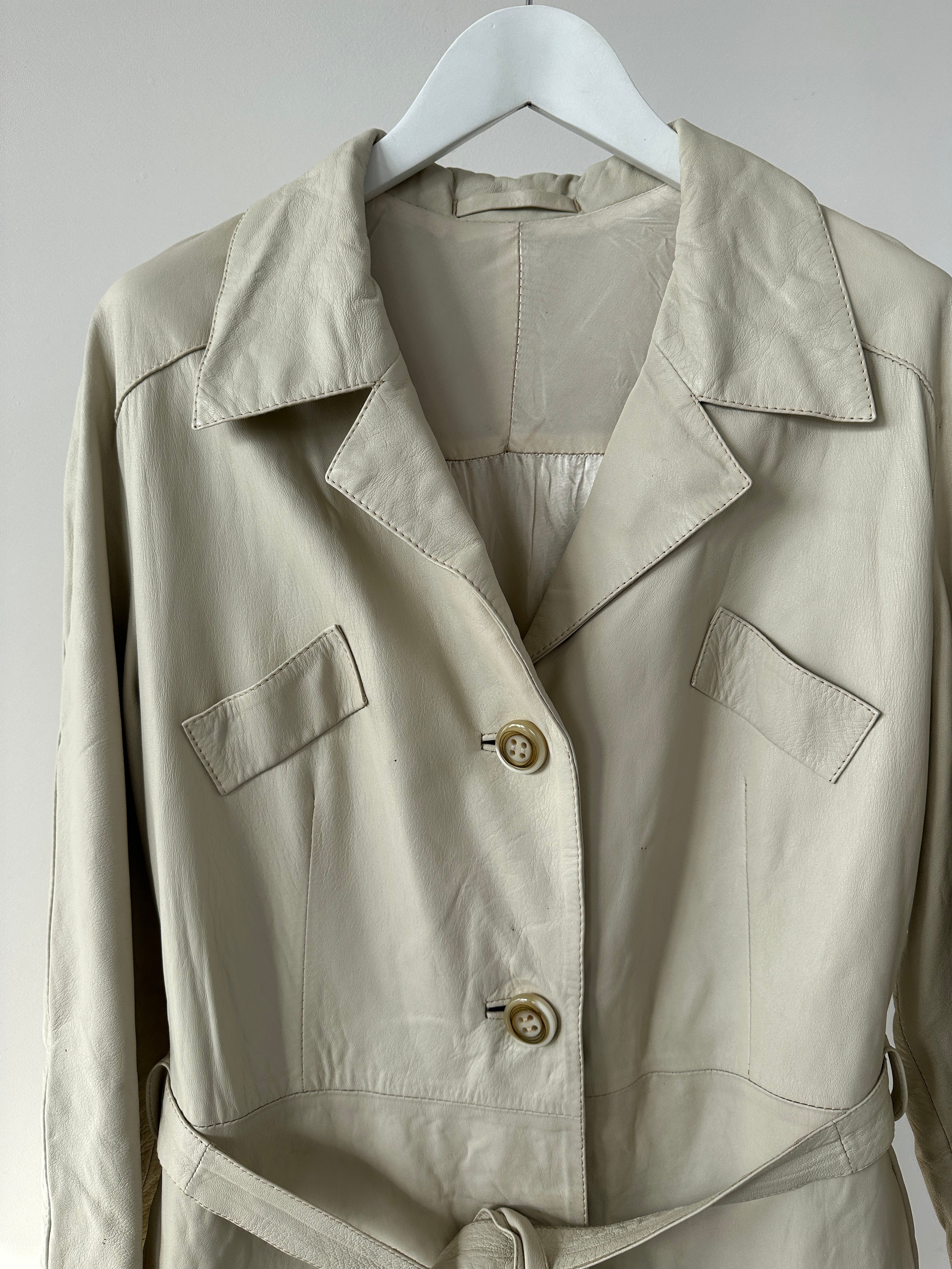 Vintage belted leather trench coat jacket in size M, featuring classic design and weather-resistant leather with a waist belt.