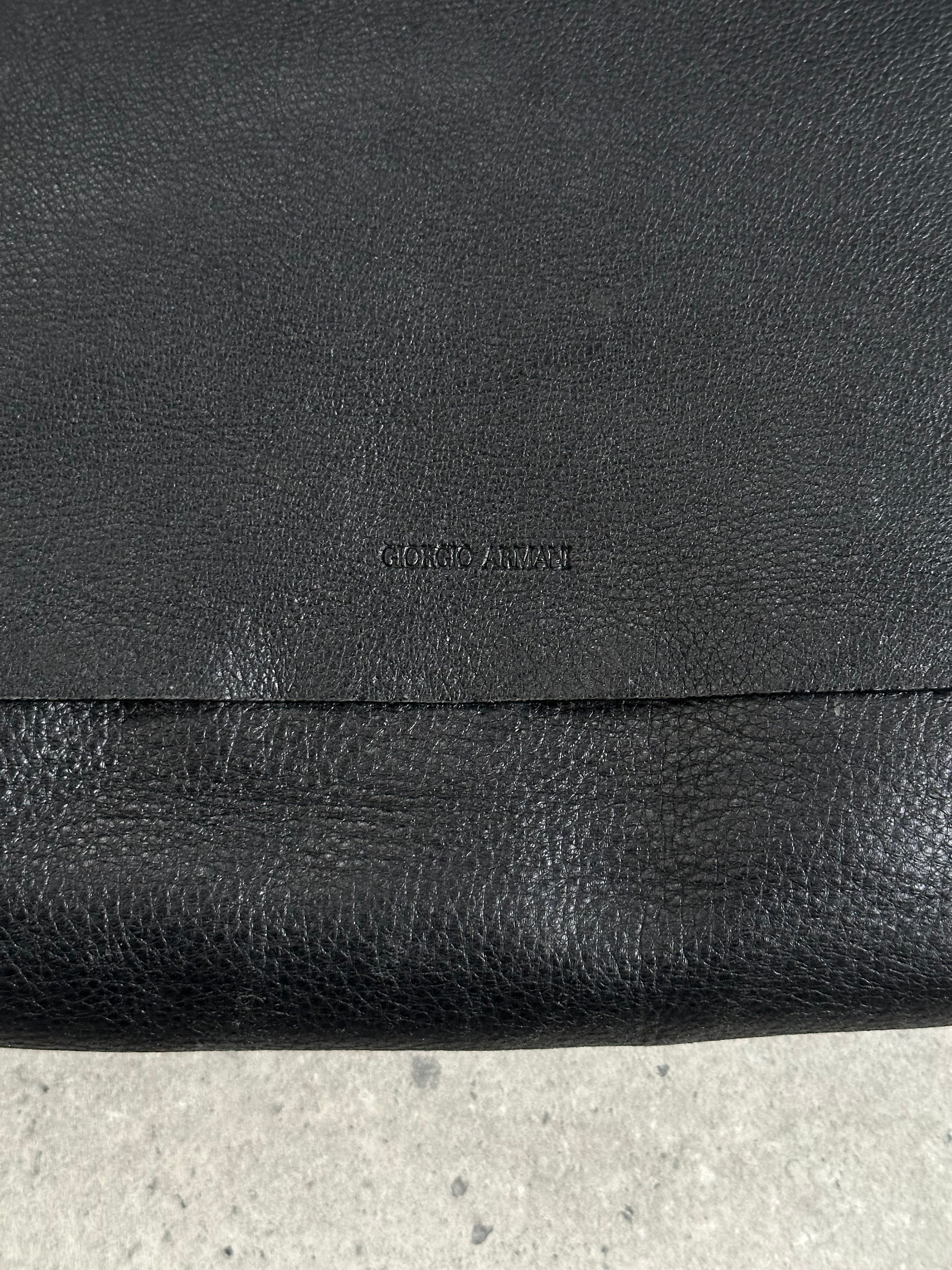 Giorgio Armani leather crossbody bag from the 2000s, featuring a sleek design and adjustable strap, crafted for style and versatility.