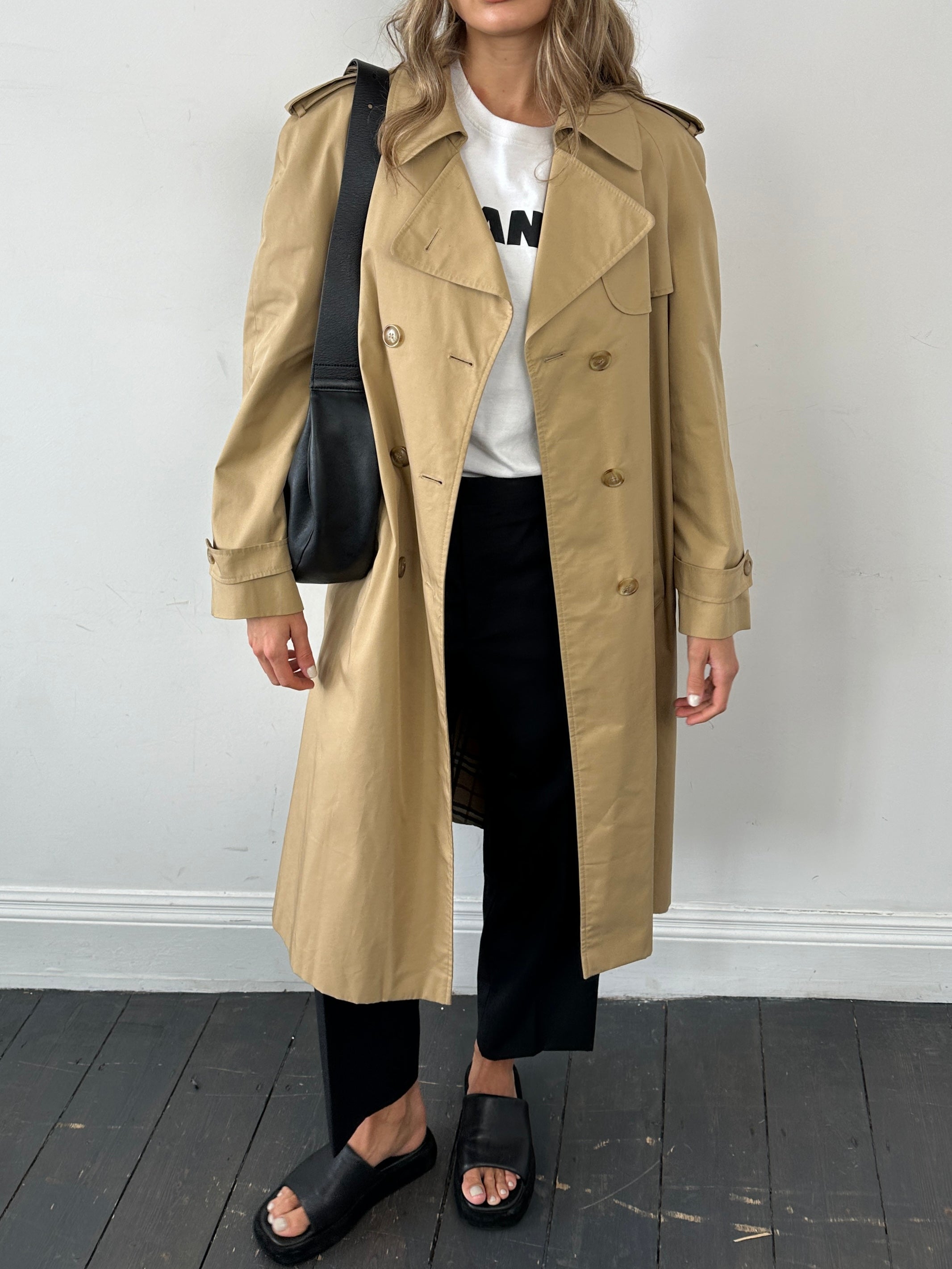 Vintage cotton double-breasted belted trench coat in size L, featuring classic design and timeless style.