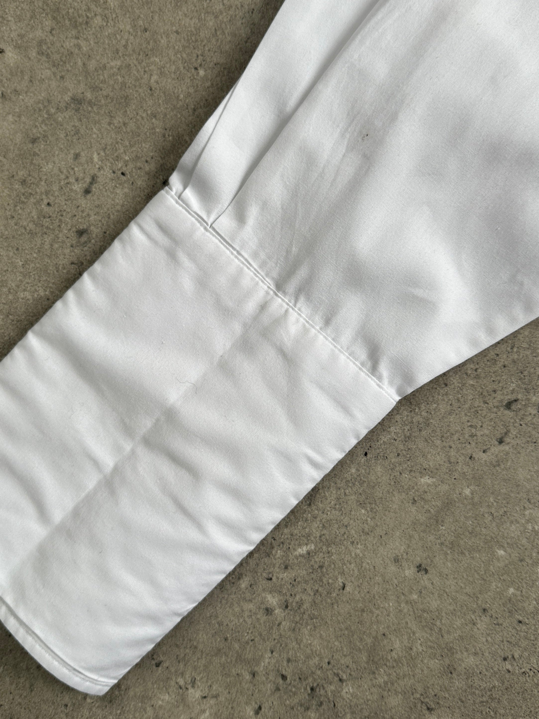 Yves Saint Laurent Pour Homme 1990s cotton dress shirt, men's size L, featuring classic logo design and white fabric.