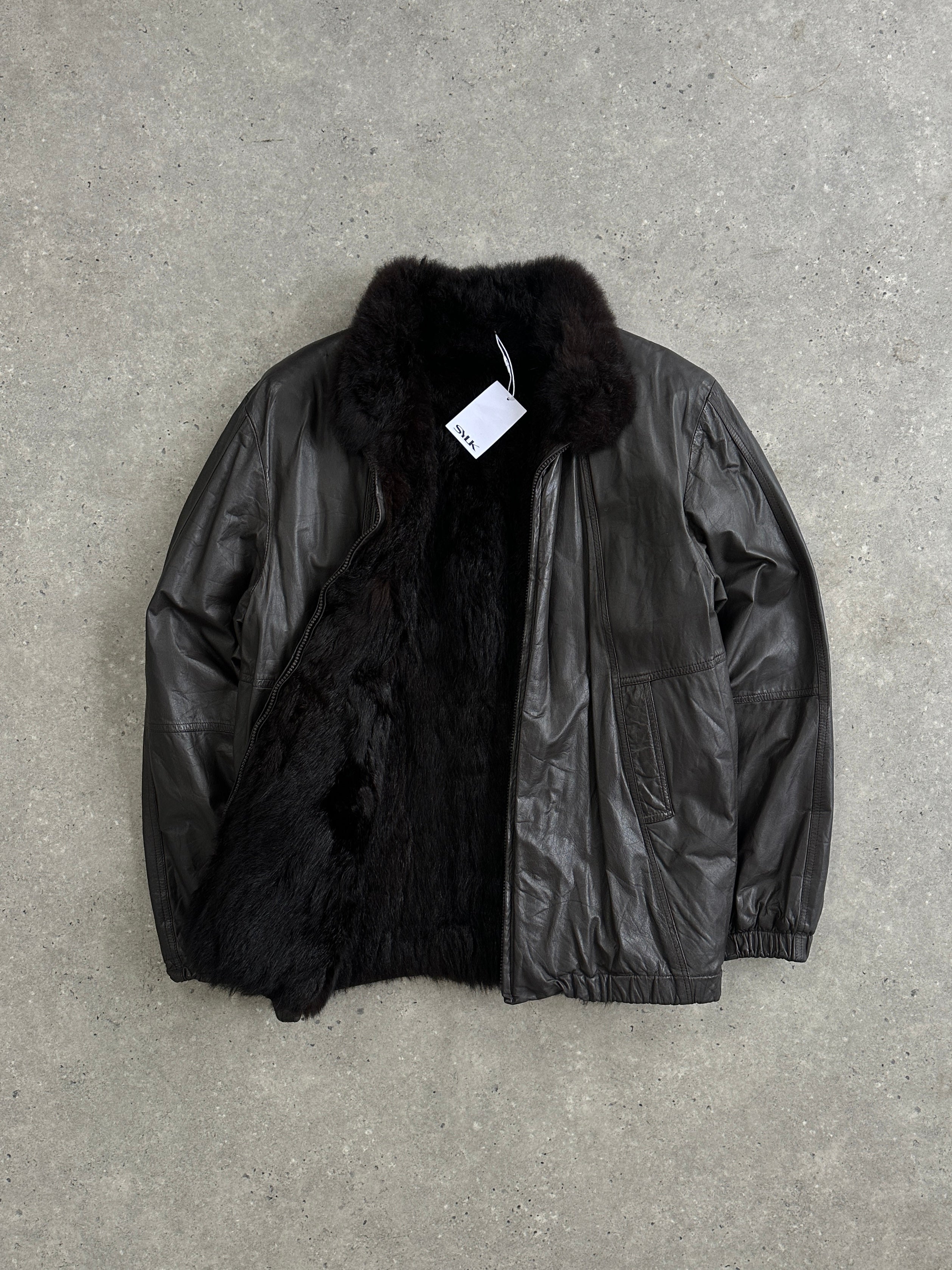 Vintage faux fur lined minimal leather bomber jacket in size S, featuring a sleek design and classic style.