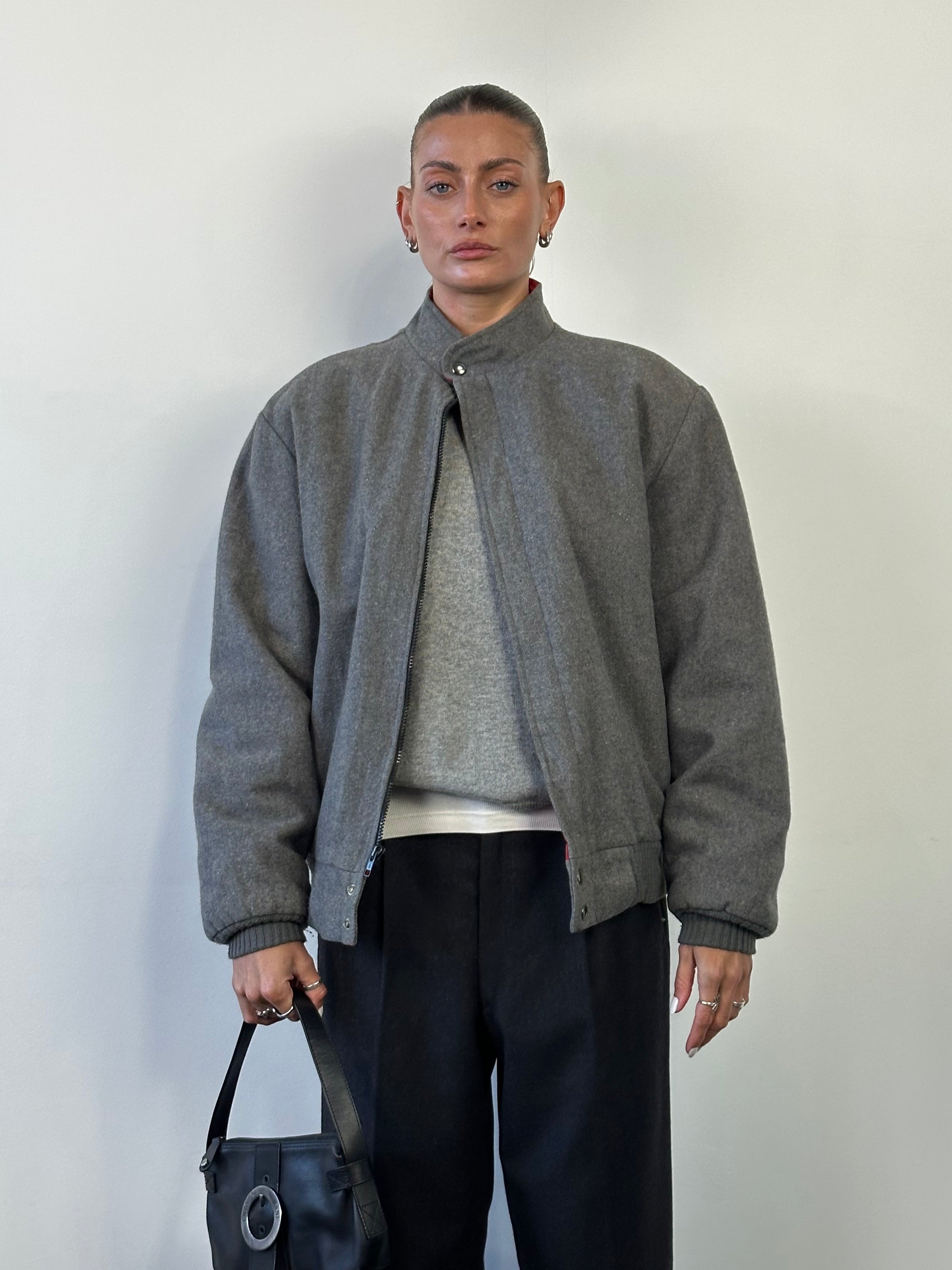 Vintage wool fleece-lined bomber jacket in size L, featuring a classic design with a zip front and ribbed cuffs and collar.