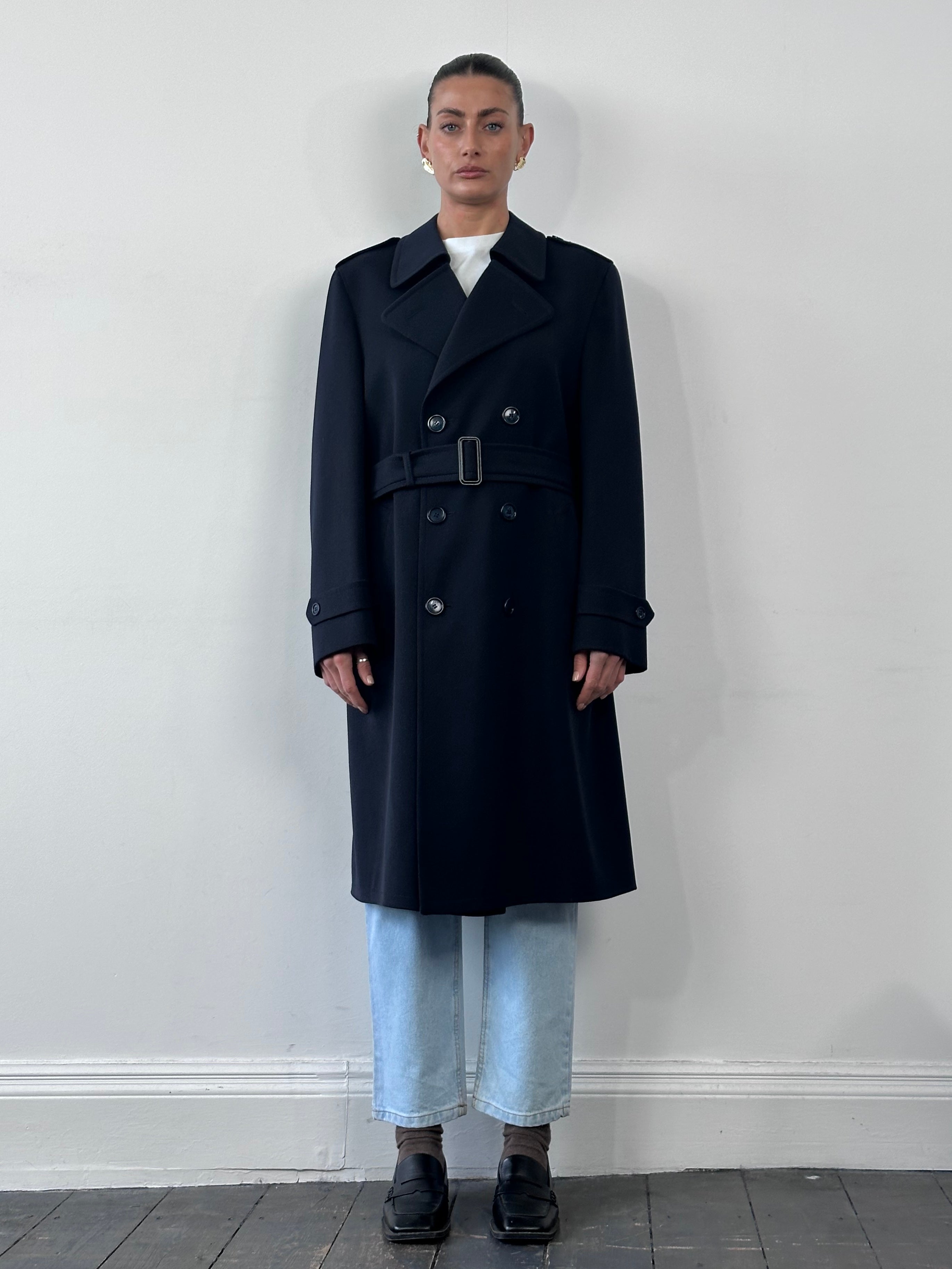 Vintage wool twill trench coat in XL with belted waist, classic design, and double-breasted front, displayed on a hanger.