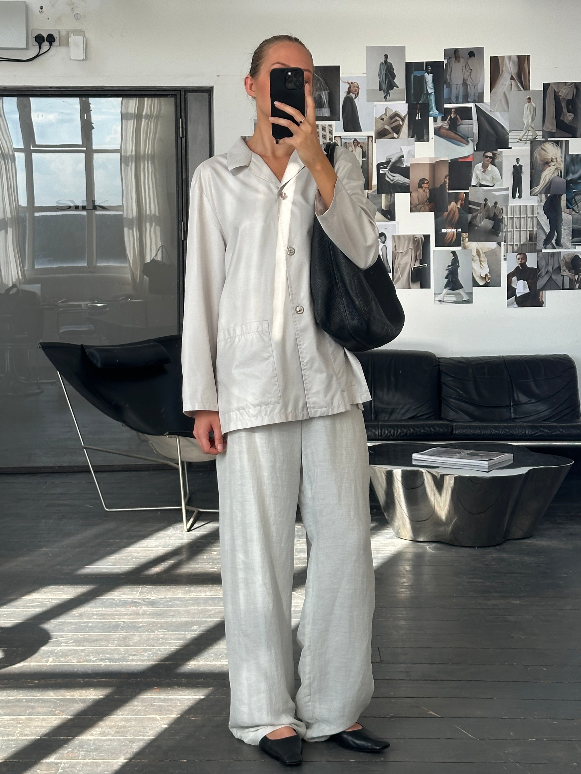 Lightweight vintage 1990s Italian unlined jacket in size L, with classic design and subtle detailing, displayed on a hanger.