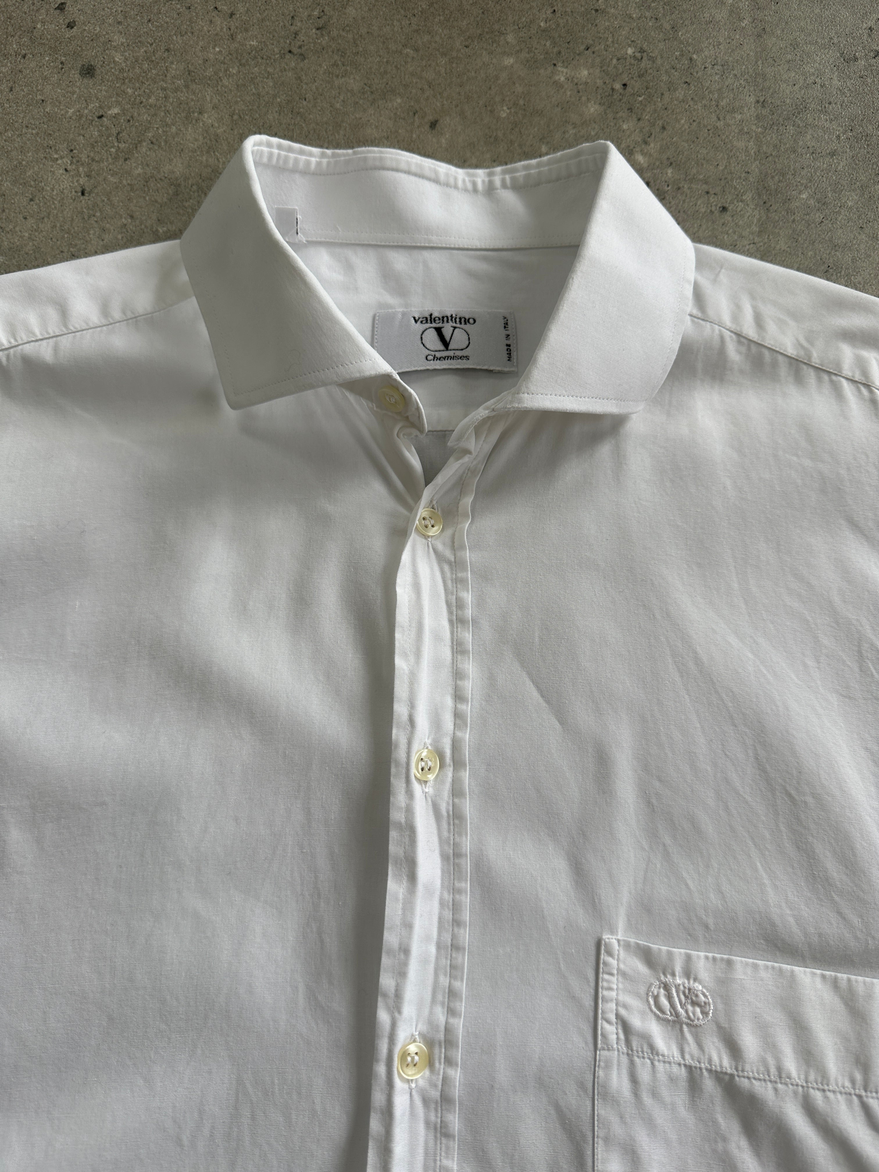 Valentino 2000s cotton logo shirt in size L/XL, featuring a classic design with the Valentino brand logo on the front.