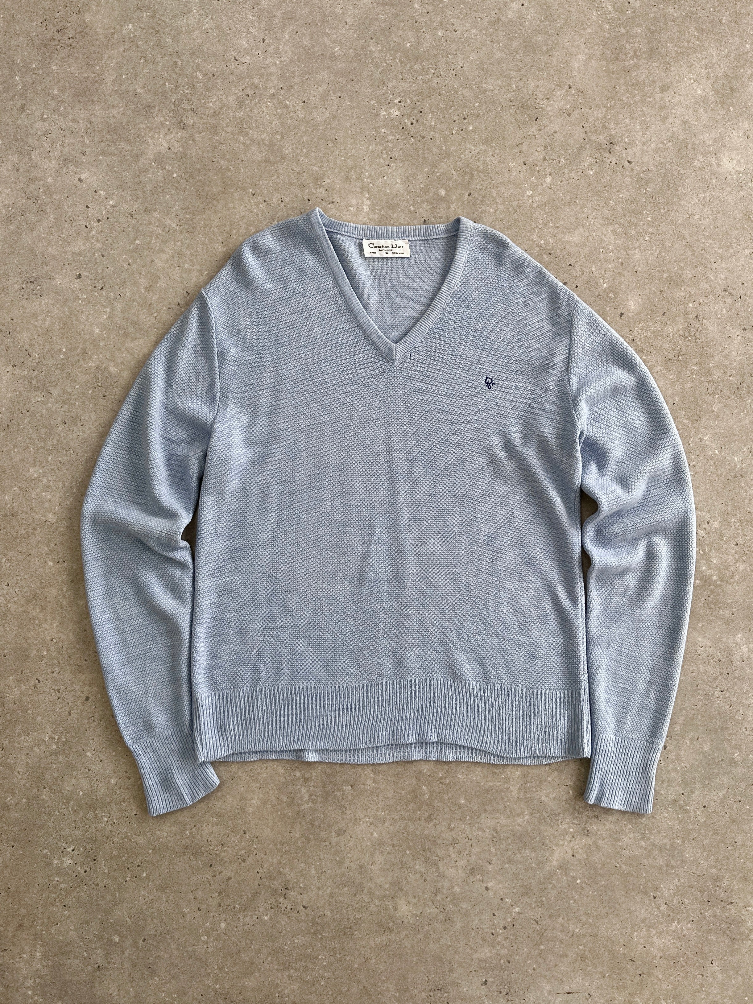 Christian Dior Monsieur V neck logo knitted jumper in size L/XL, featuring a classic design with Dior branding and knit texture.