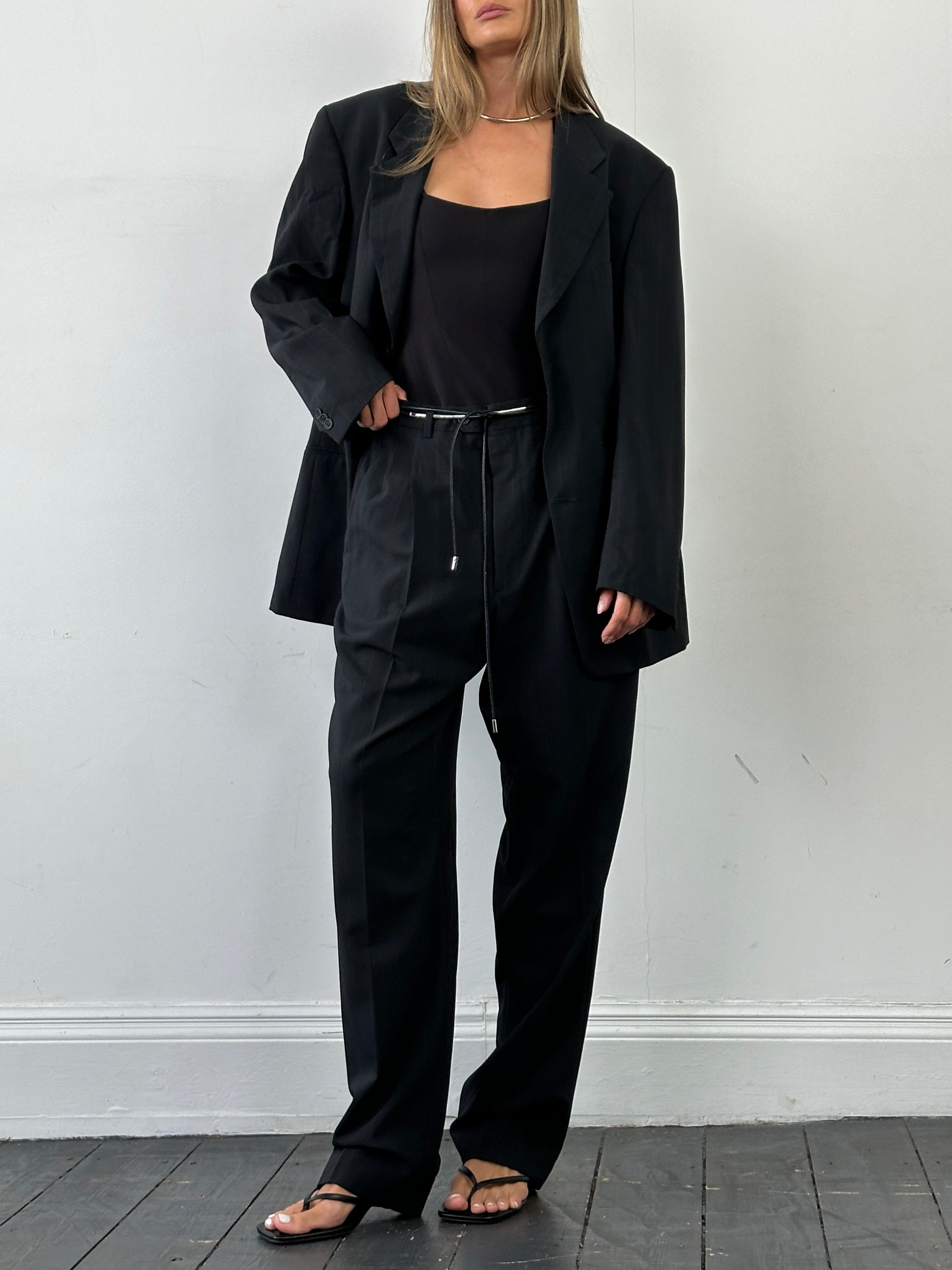 Giorgio Armani Le Collezioni pinstripe wool single-breasted suit in 46R/W36, displayed as a stylish jumpsuit with tailored fit.