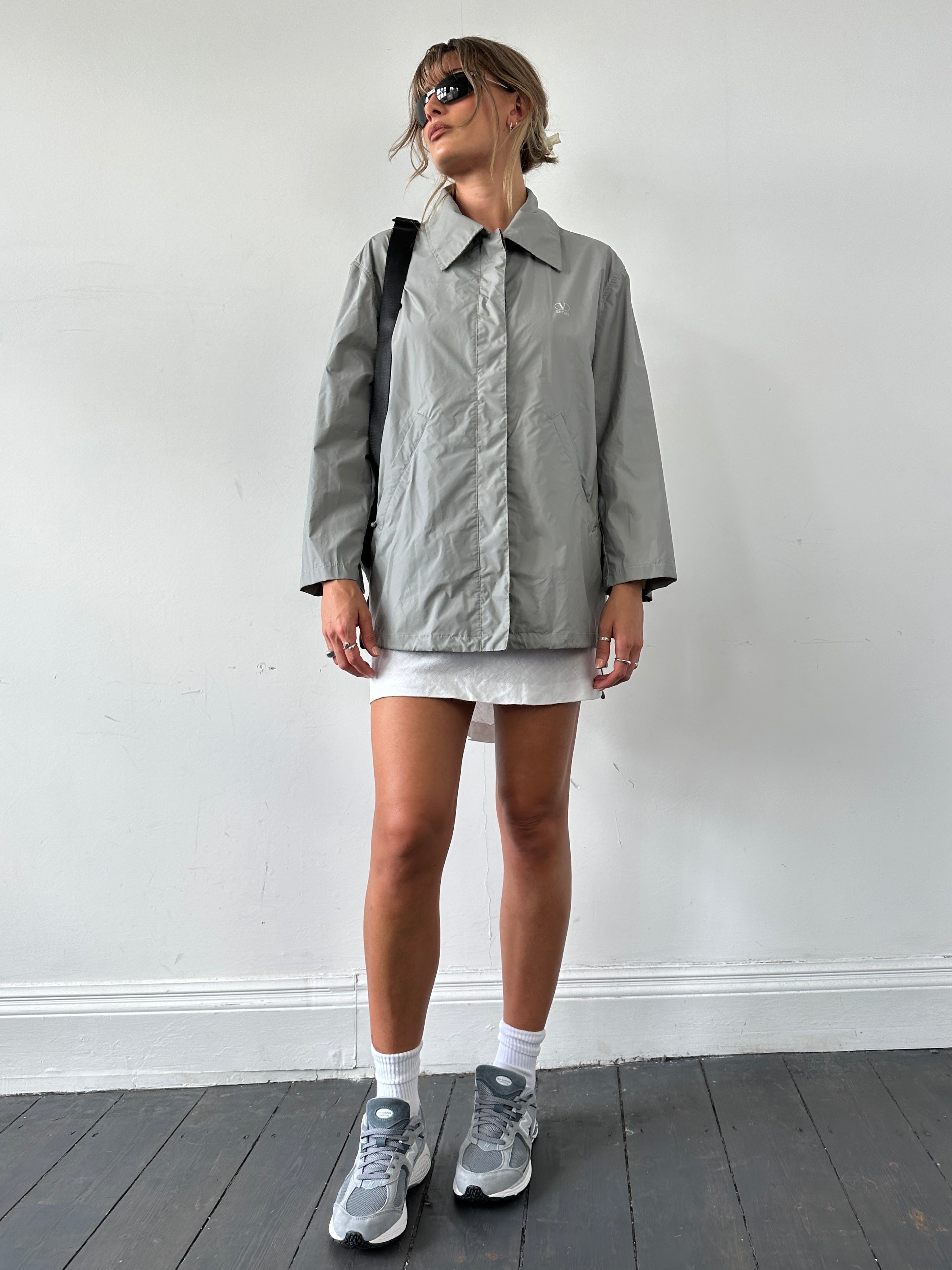 Valentino Sport raincoat jacket in size L, lightweight waterproof jacket with logo details, shown on a hanger.